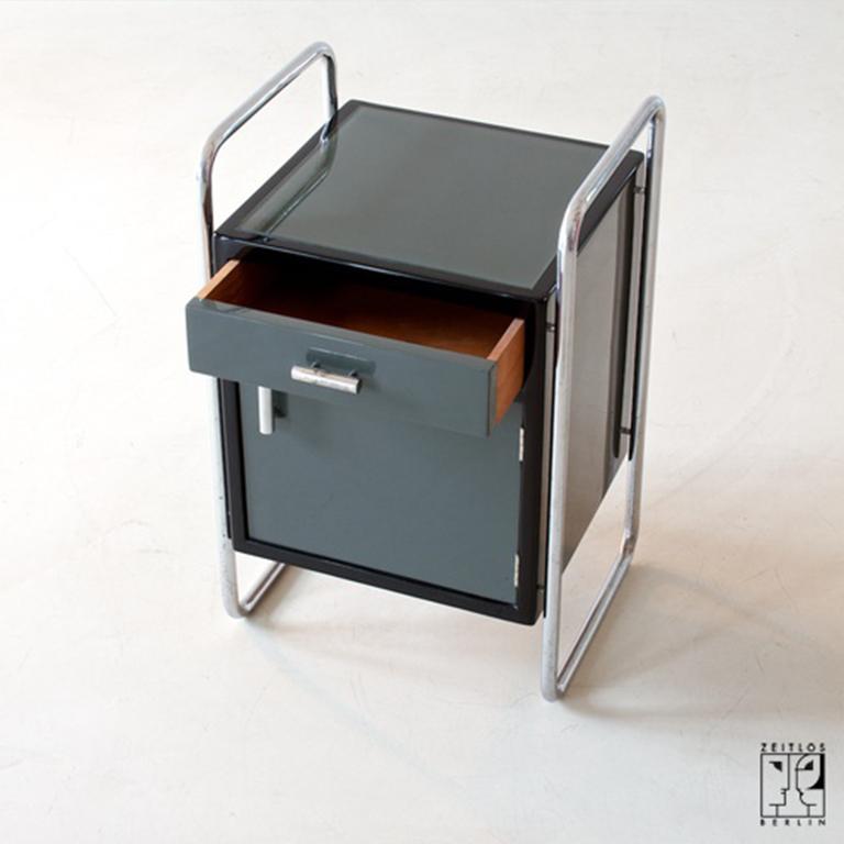 Rediscover the Bauhaus Era with our 1930s Tubular Steel Side Cabinet

Presenting our exclusive 1930s Bauhaus Tubular Steel Side Cabinet, a genuine piece from the zenith of modern design, now beautifully restored by ZEITLOS-BERLIN. This side cabinet