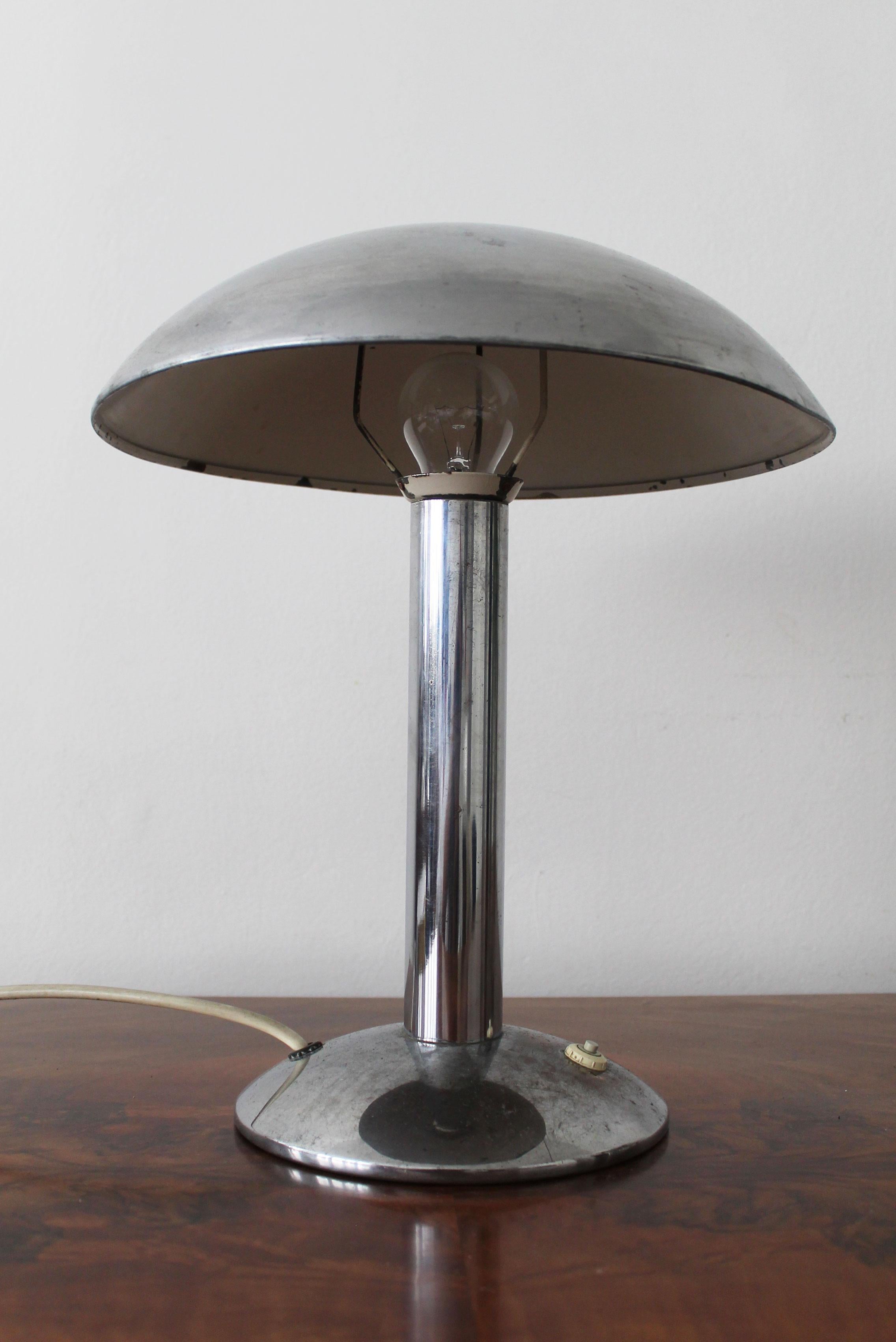 This Modernist Chrome table lamp was produced by NAPAKO Company in the 1930’s but was originally designed by lighting engineer Miloslav Prokop for the Vorel Praha Company.

Miloslav Prokop was a visionary and the most influential lighting designer