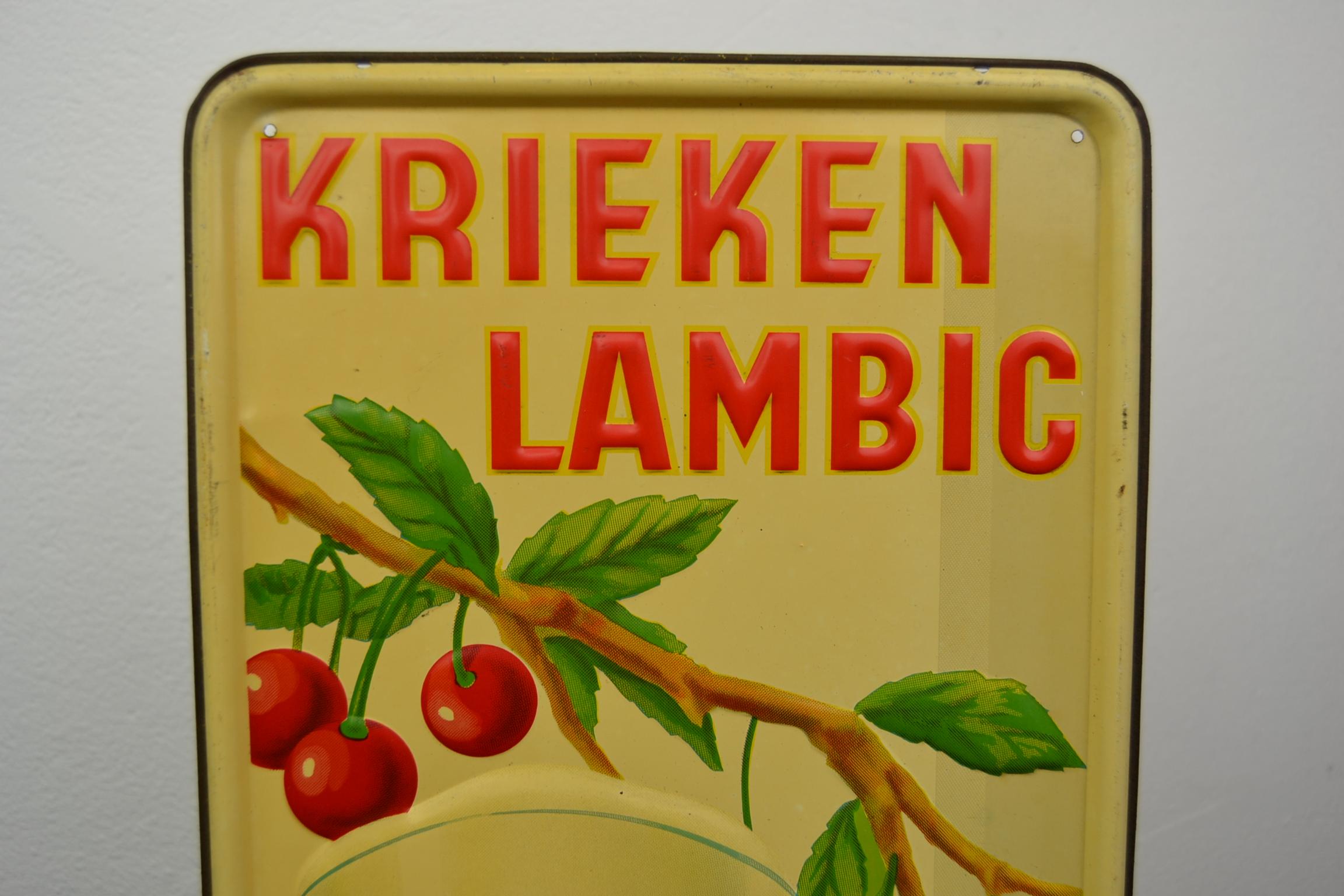 1930s tin advertising sign for Belgian beer, cherry beer Lambic.
This tin publicity sign for brewery dry- pikkel (1904-1955) dates from 1937
And was made by Jofico Brussels.
The bright red color of the cherries and the glass filled with cherry