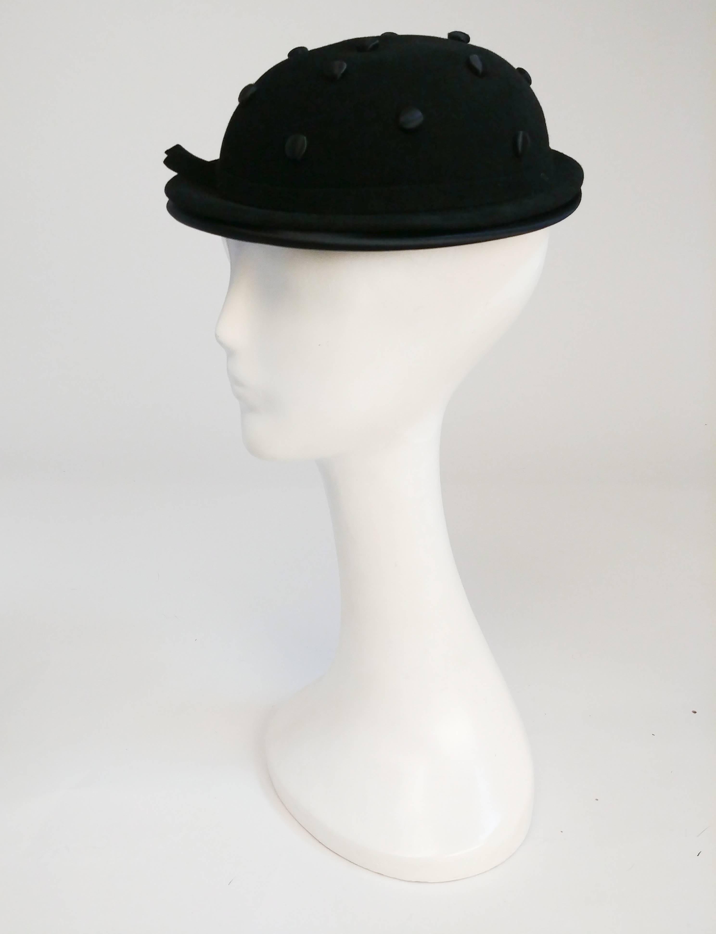 1930s Black Hat w/ Covered Buttons.Black fur felt hat with satin covered buttons and inner brim and elastic band secures hat to head. Size 22 inch