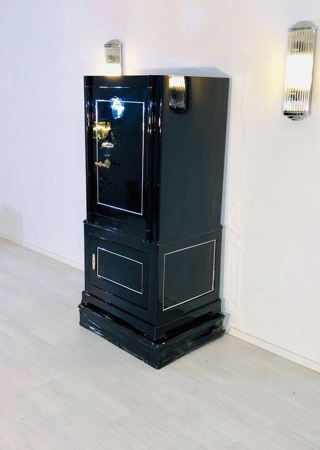 Stunning 1930s black lacquer safe or vault from Switzerland. We got the original item from a mansion of a banker in Zurich who got it from the security company C.A. Streuli in St.Gallen, Switzerland. It got restored in our manufactory and newly