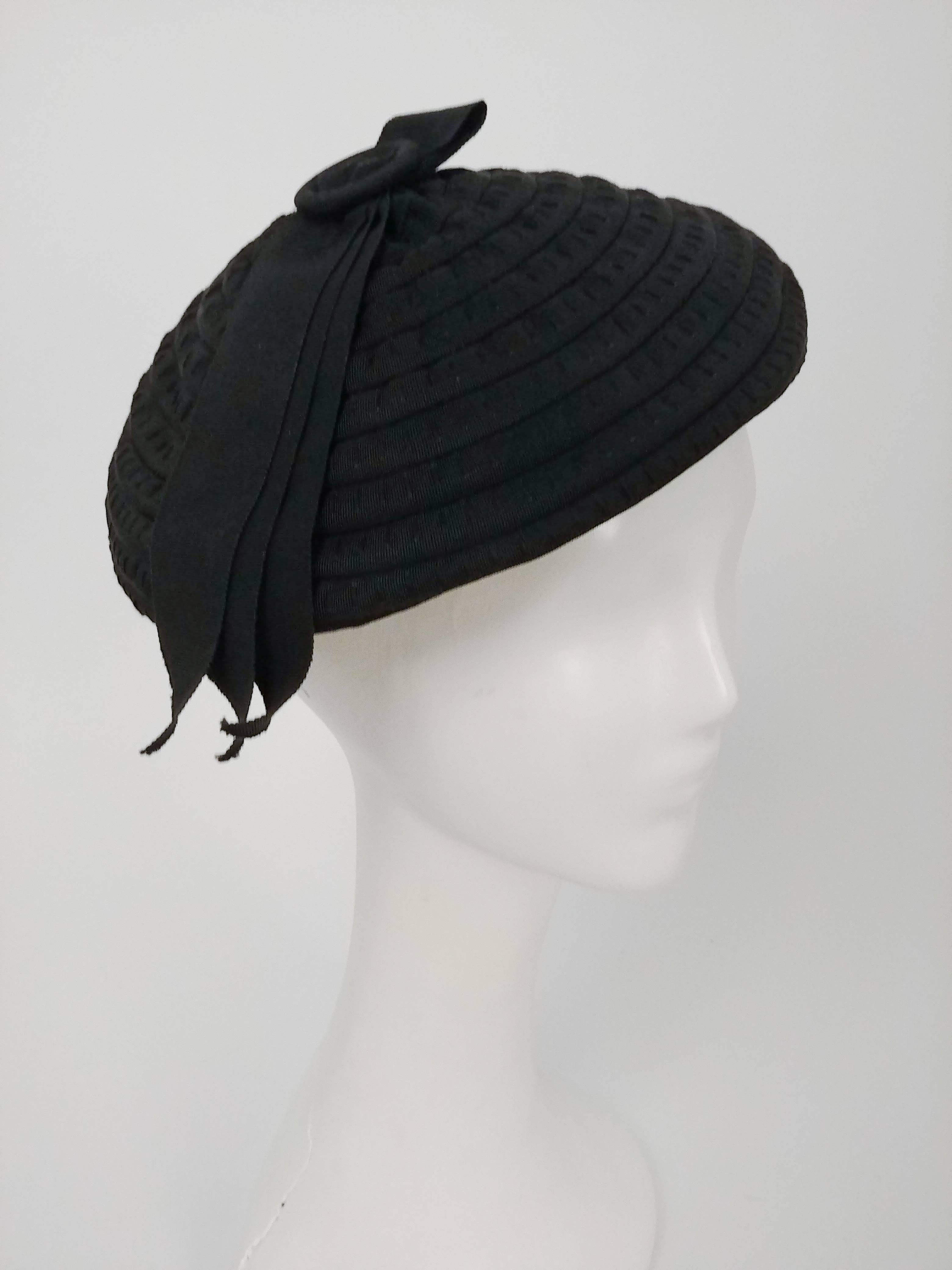1930s Black Spiral Ribbon Beret. Beret made of gathered grosgrain ribbon sewn in a spiral, further embellished with ribbon and button at top center of hat. 