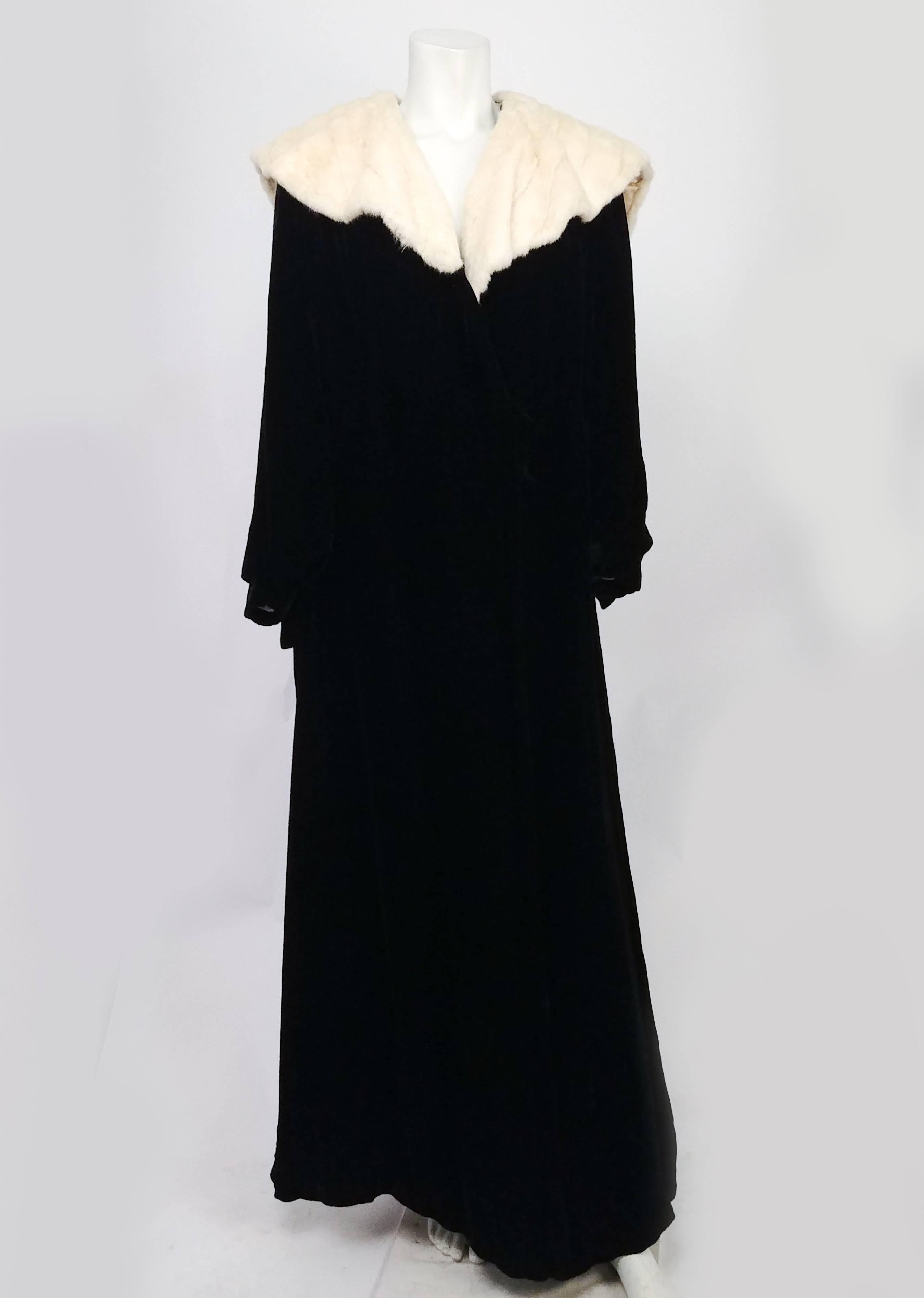 1930s Black Velvet Opera Coat w/ Ermine Collar. Silk velvet coat with bishop sleeves, lined with white silk, wide ermine collar. 