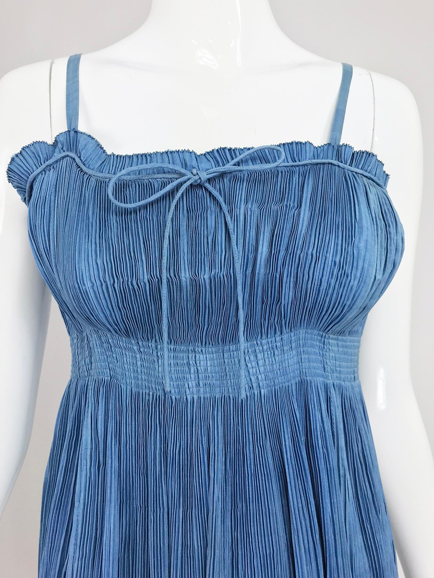 1930s Blue Pinch Pleated Raw Silk Couture Evening Gown. Completely hand made this unusual gown was certainly made for a special event! The blue has a lot of depth, light and luster, the use of the raw silk, pleated as it is, is quite unique. I would