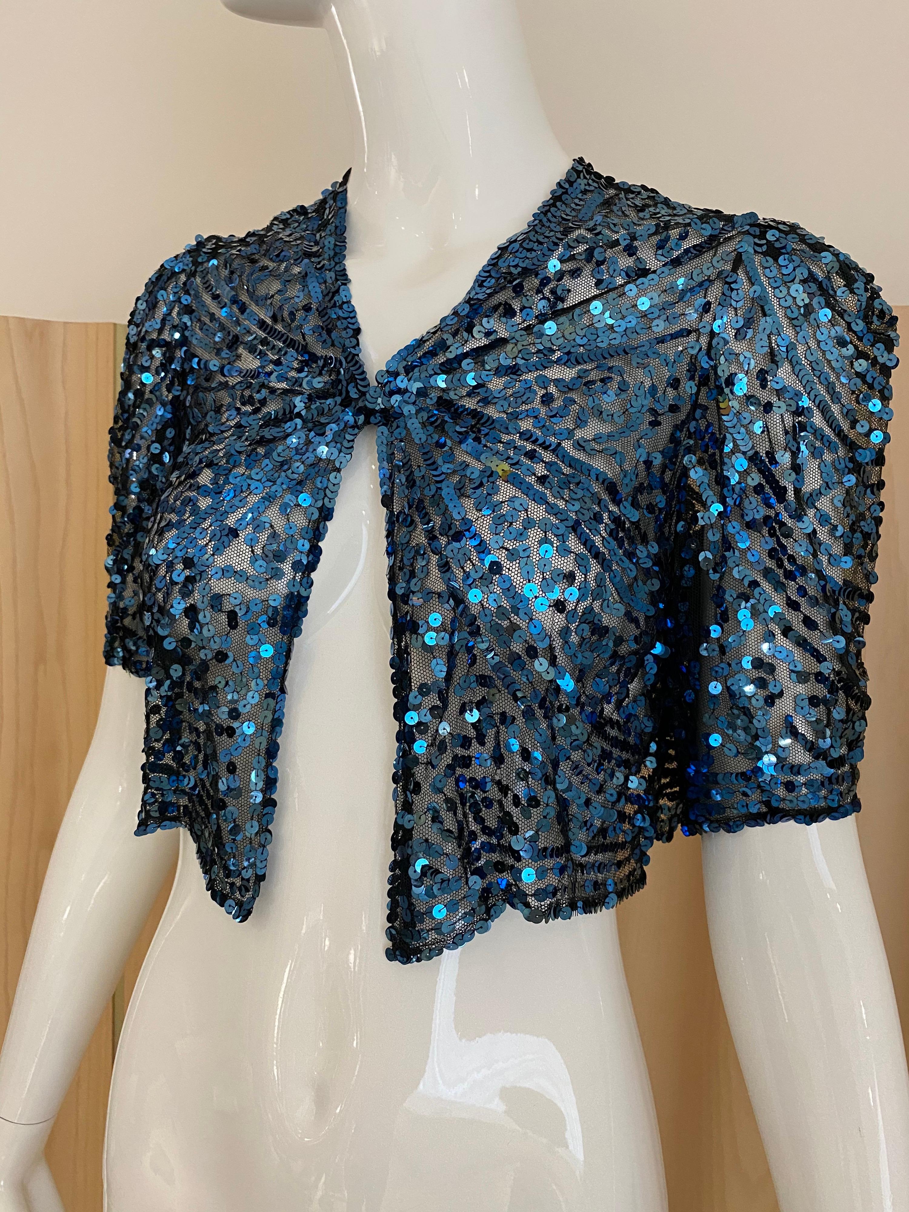 Beautiful 1930s blue sequin bolero crops jacket.
Size 2/4 for small
