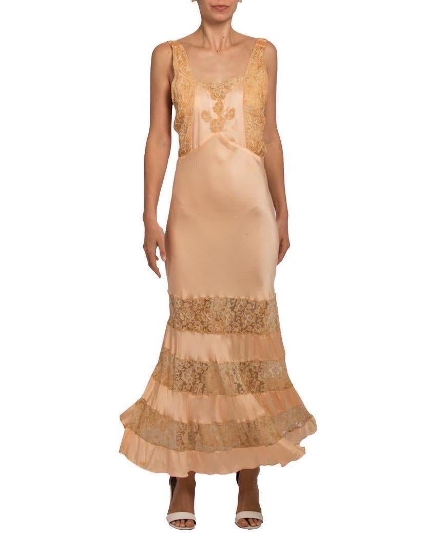 In exceptional wearable condition however there are a few subtle spots. The silk is luscious and of the finest quality, a rare and covetable piece with a dramatic full skirt. 1930S Blush Pink Bias Cut Silk Charmeuse Negligee Beautifully Trimmed With