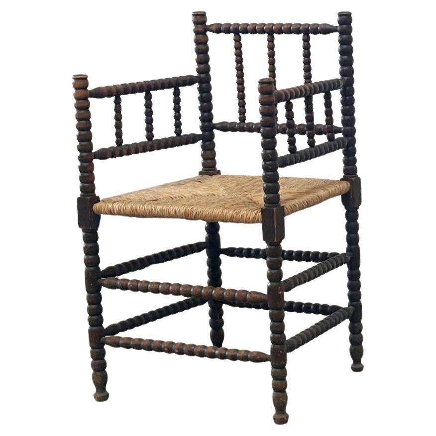 Fauteuil à dossier bas Bobbin 1930 en vente