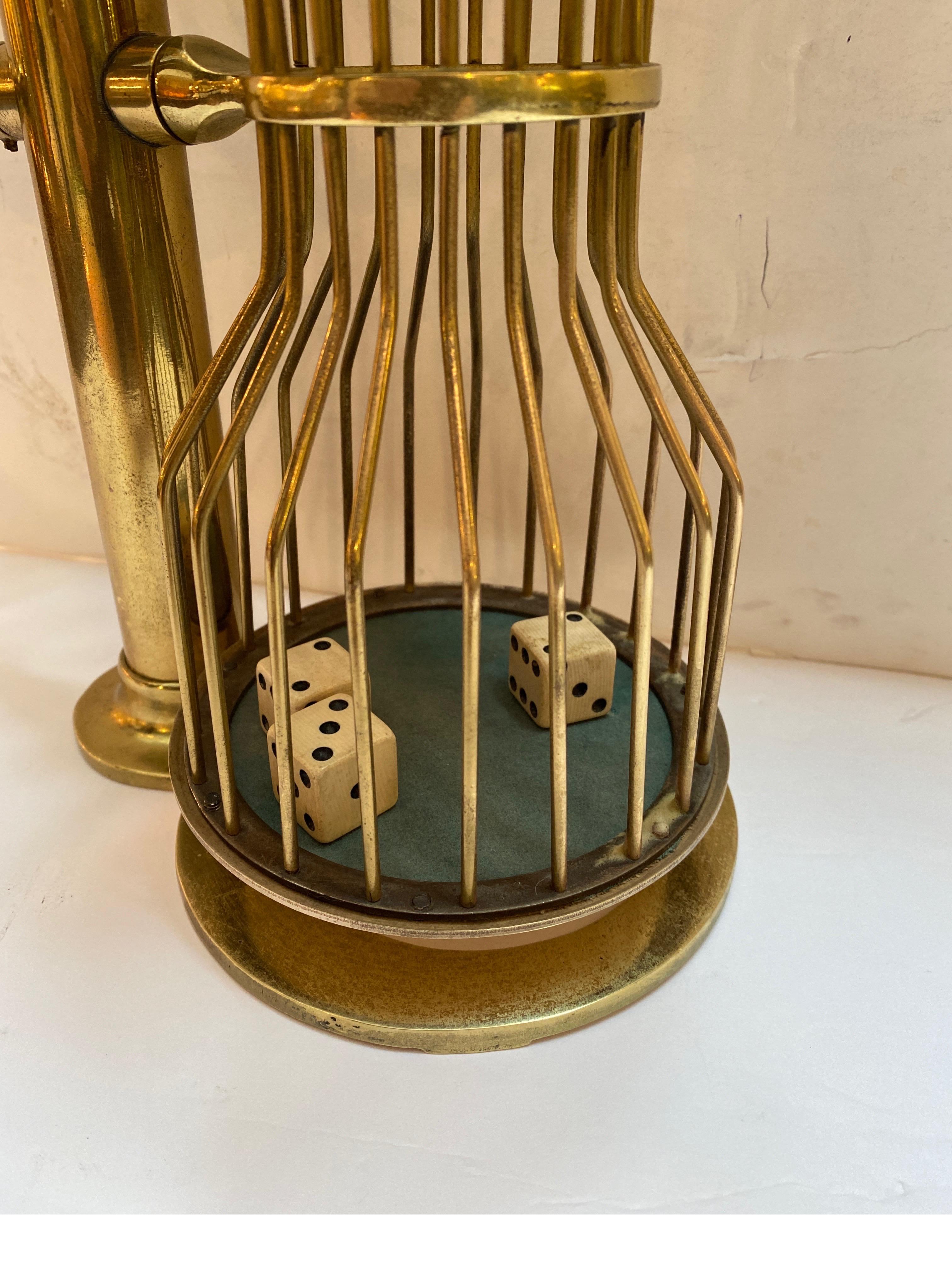 A brass 1930's cage with dice. Used for gambling and card game of 