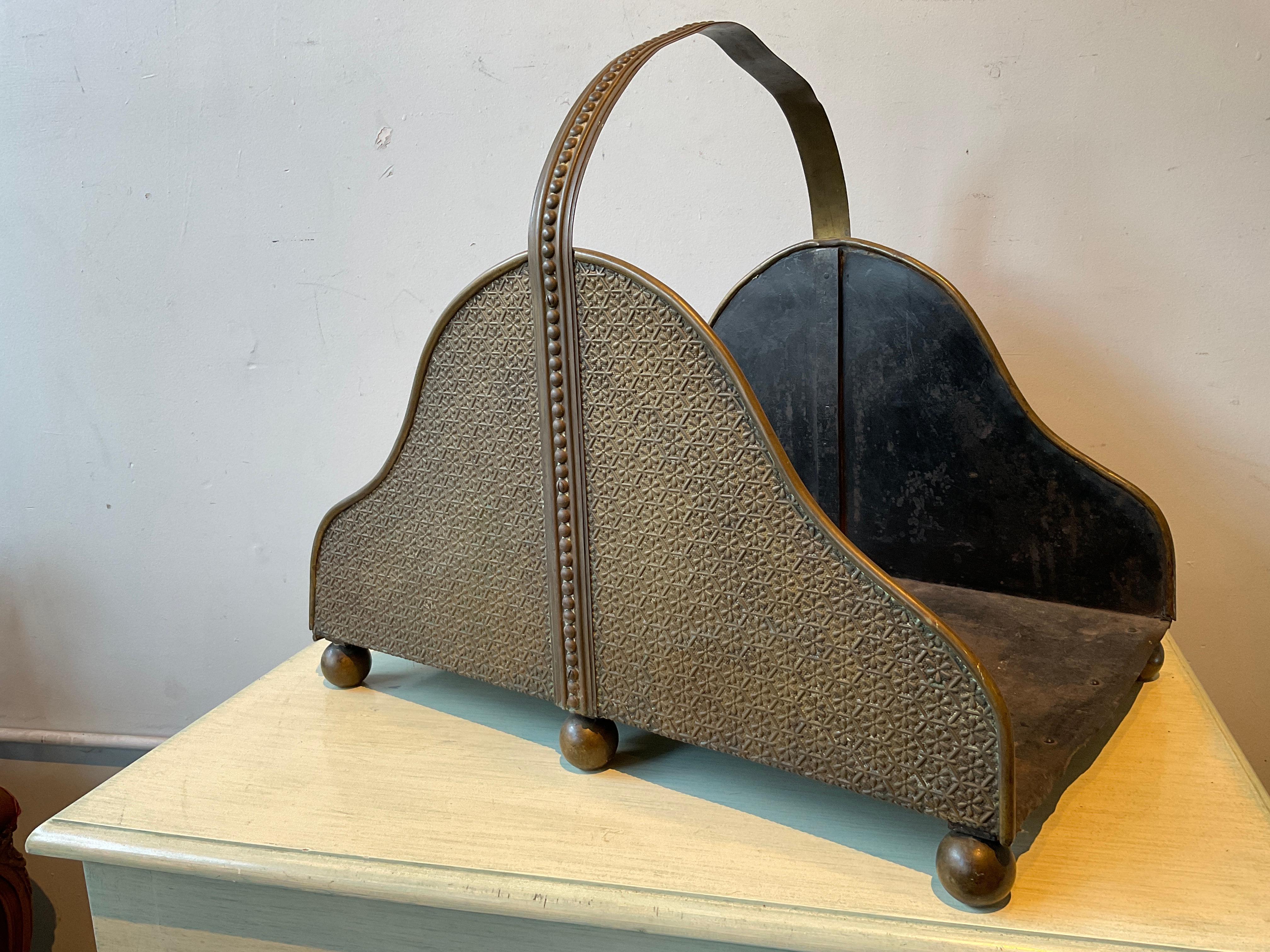 1930s Brass log holder . Bend in handle as shown in picture.