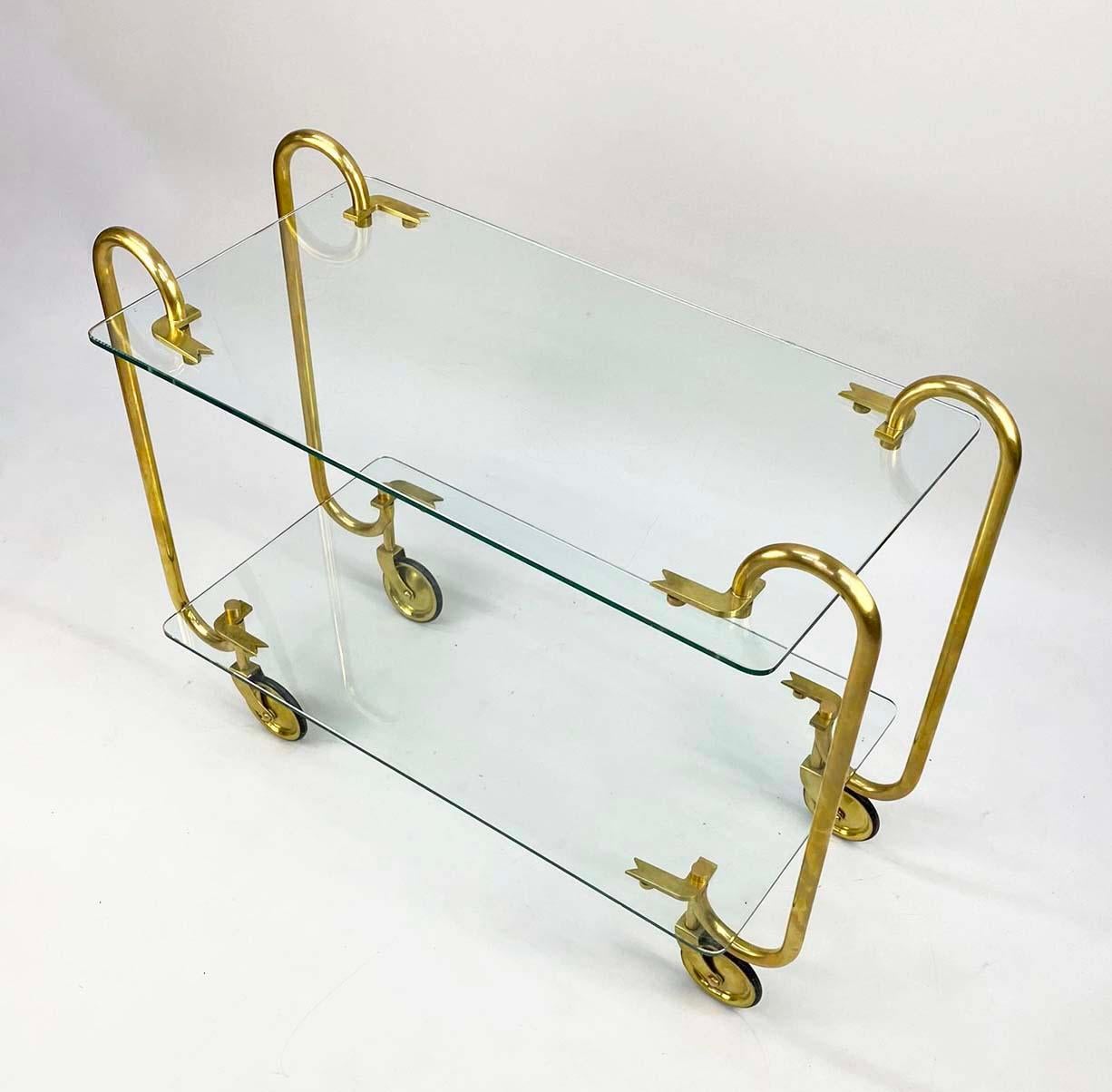 This 1930s STUNNING brass and glass Italian bar or beverage cart is rare--and when examples do show up, the design is said to be by Gio Ponti for Fontane Arte. This could very well be the case, but we do not have documentation, so we are selling