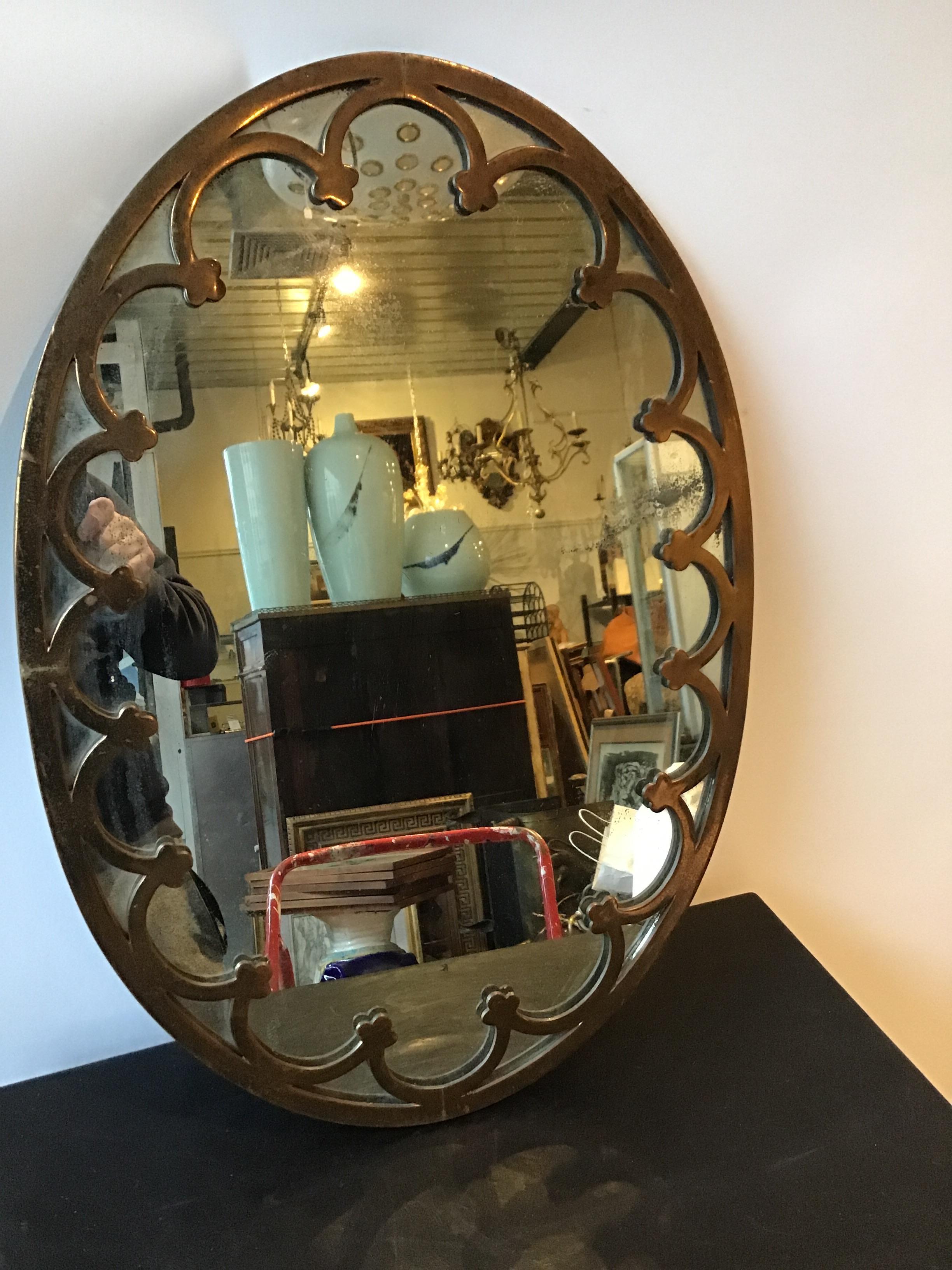1930s brass oval mirror. This mirror can be shipped through UPS.