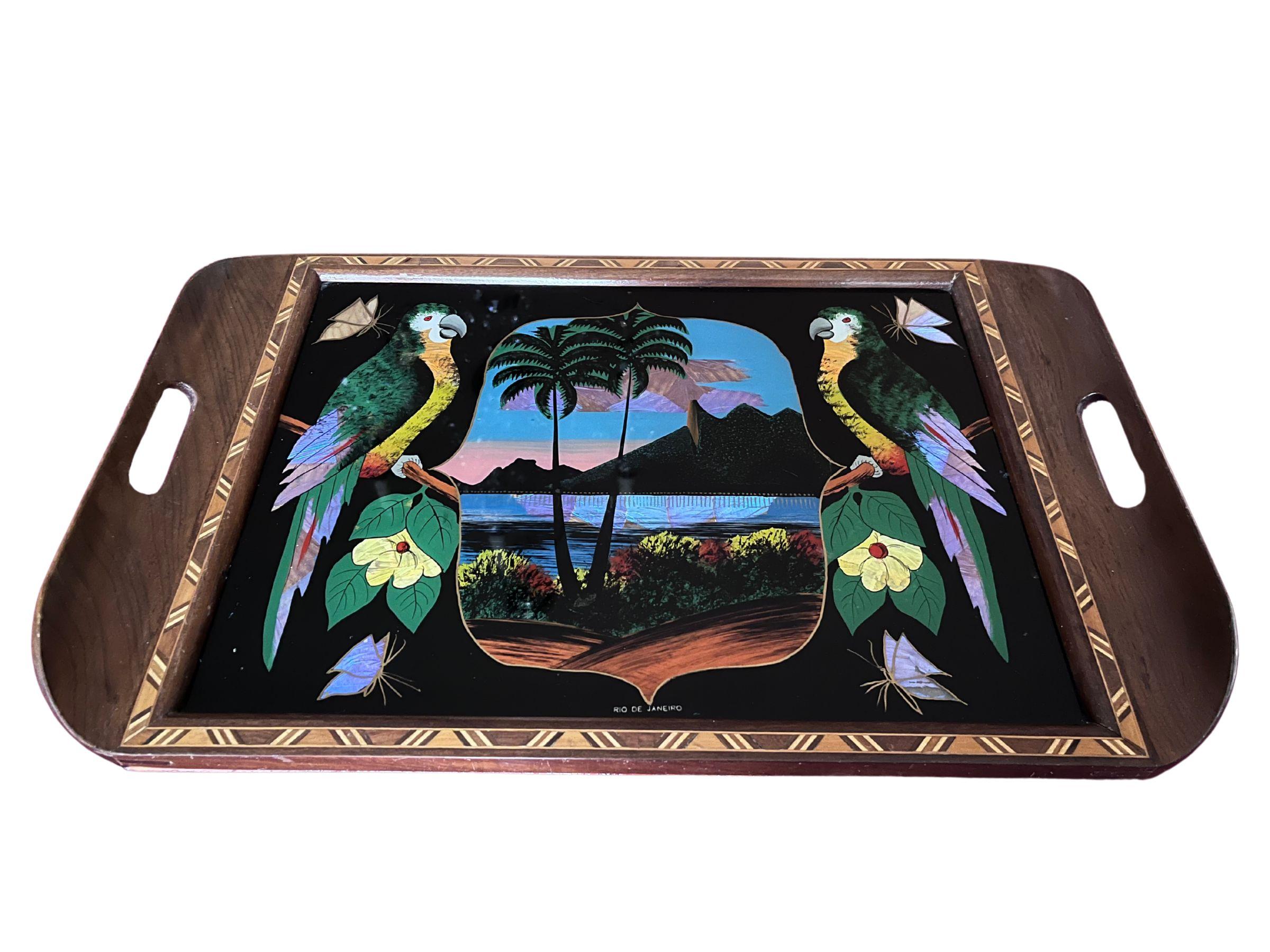 Rare 1930s Brazilian Art Deco Butterfly Wing Cocktail Tray – Reverse Glass Painted Rio de Janeiro Landscape with Parrots & Marquetry Frame

This striking 1930s Brazilian Art Deco cocktail tray is a rare and beautiful example of decorative barware