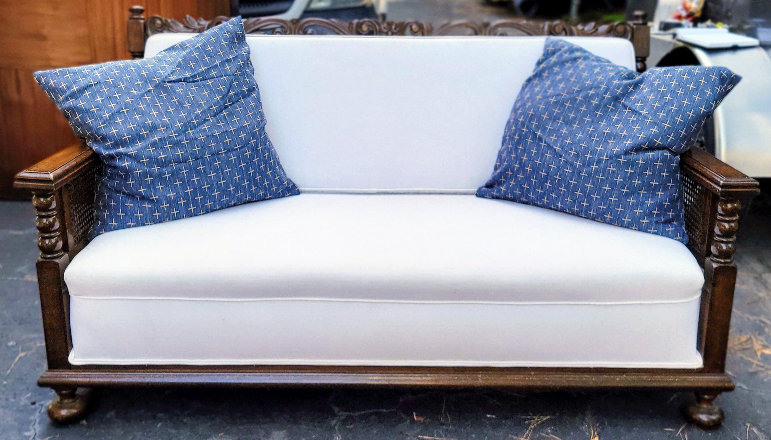 English 1930s British Colonial Style Blue and White Carved Oak Sofa / Settee Cane Back