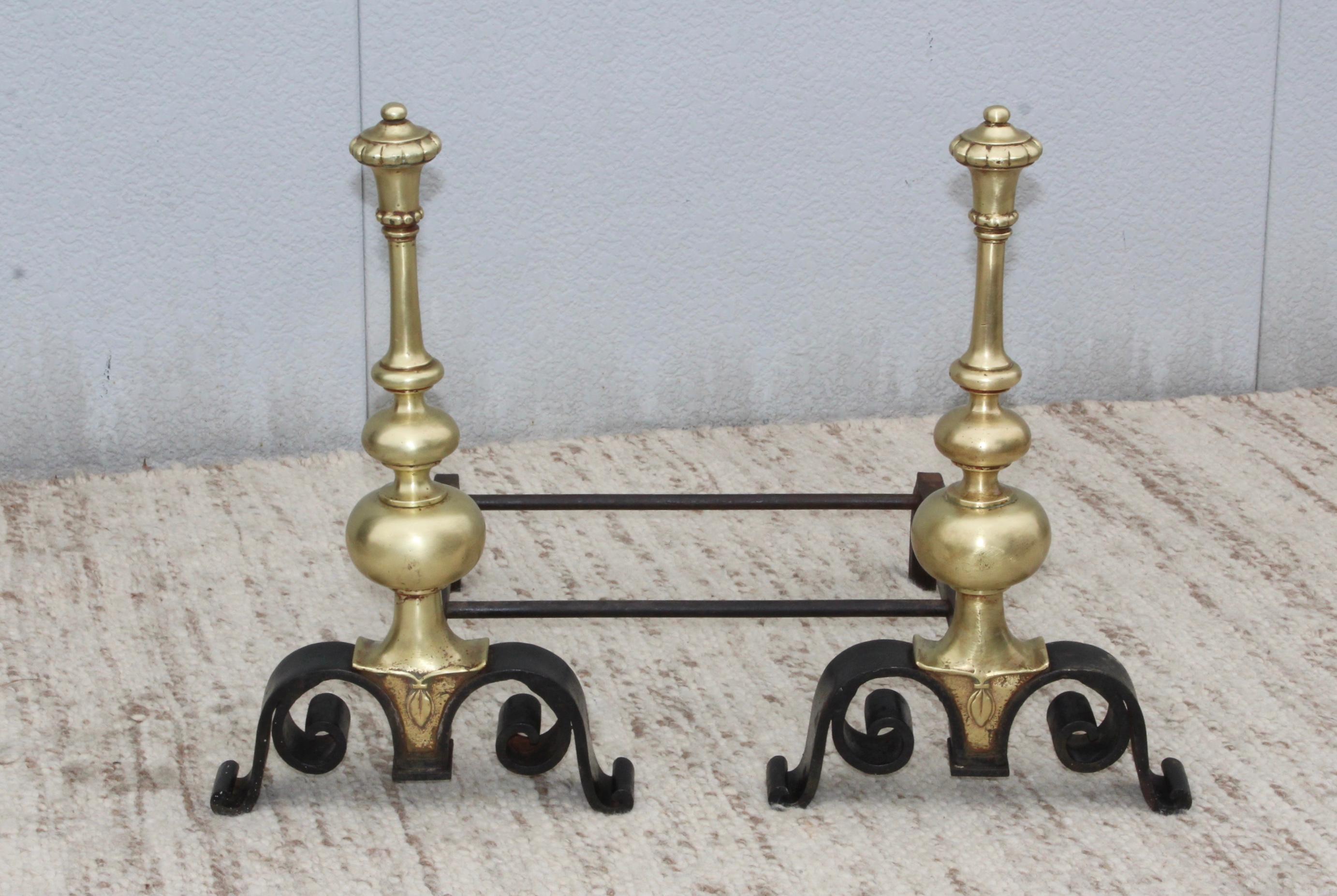 Stunning 1930s bronze and iron andirons from the Biltmore Hotel in NYC. in vintage condition well made and very heavy.