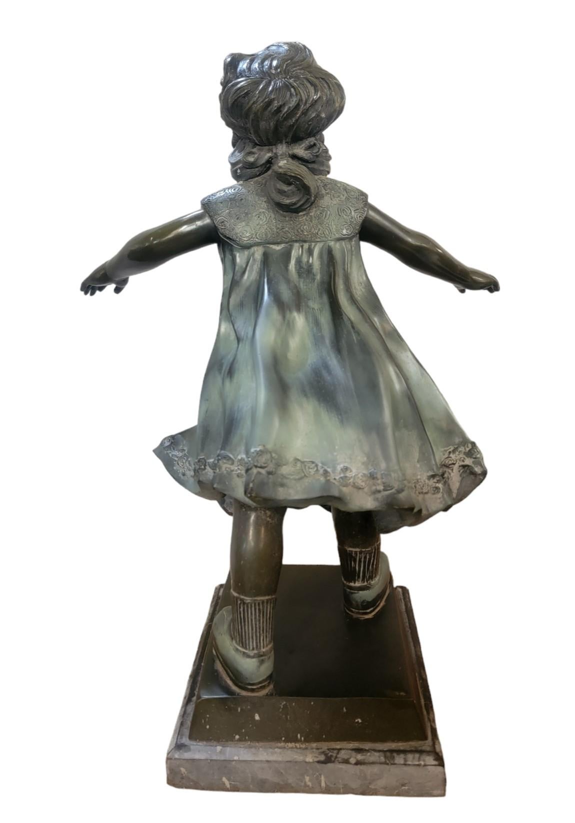 1930s of a youthful girl playing Marco polo. 
Blind folded and provided an energetic youthful pose. A great fun sculpture to bring the youth out of any purchaser.