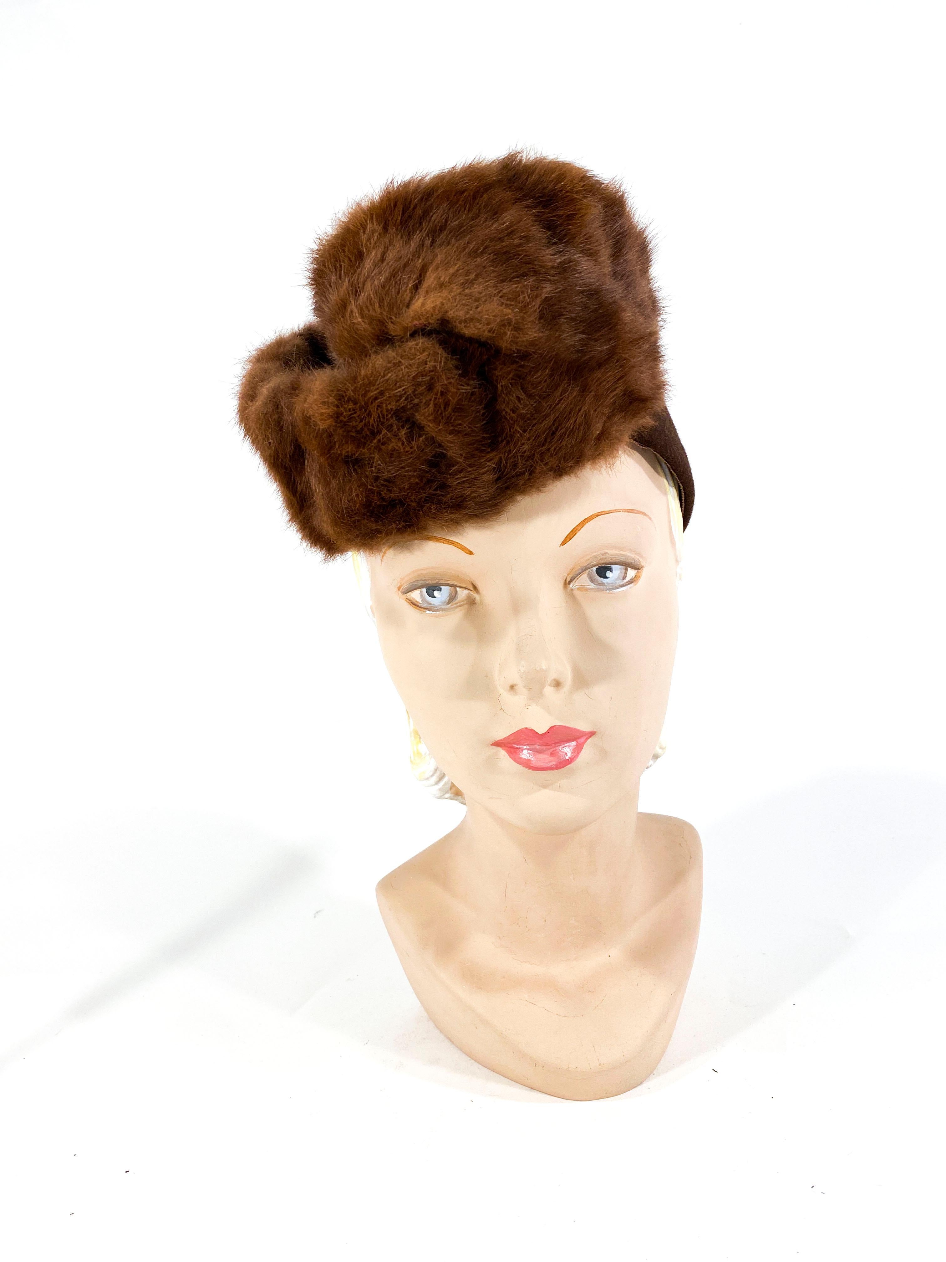 1930s brown sculpted fur felt hat with a plush stone-martin trim and cut outs on the base of the hat.