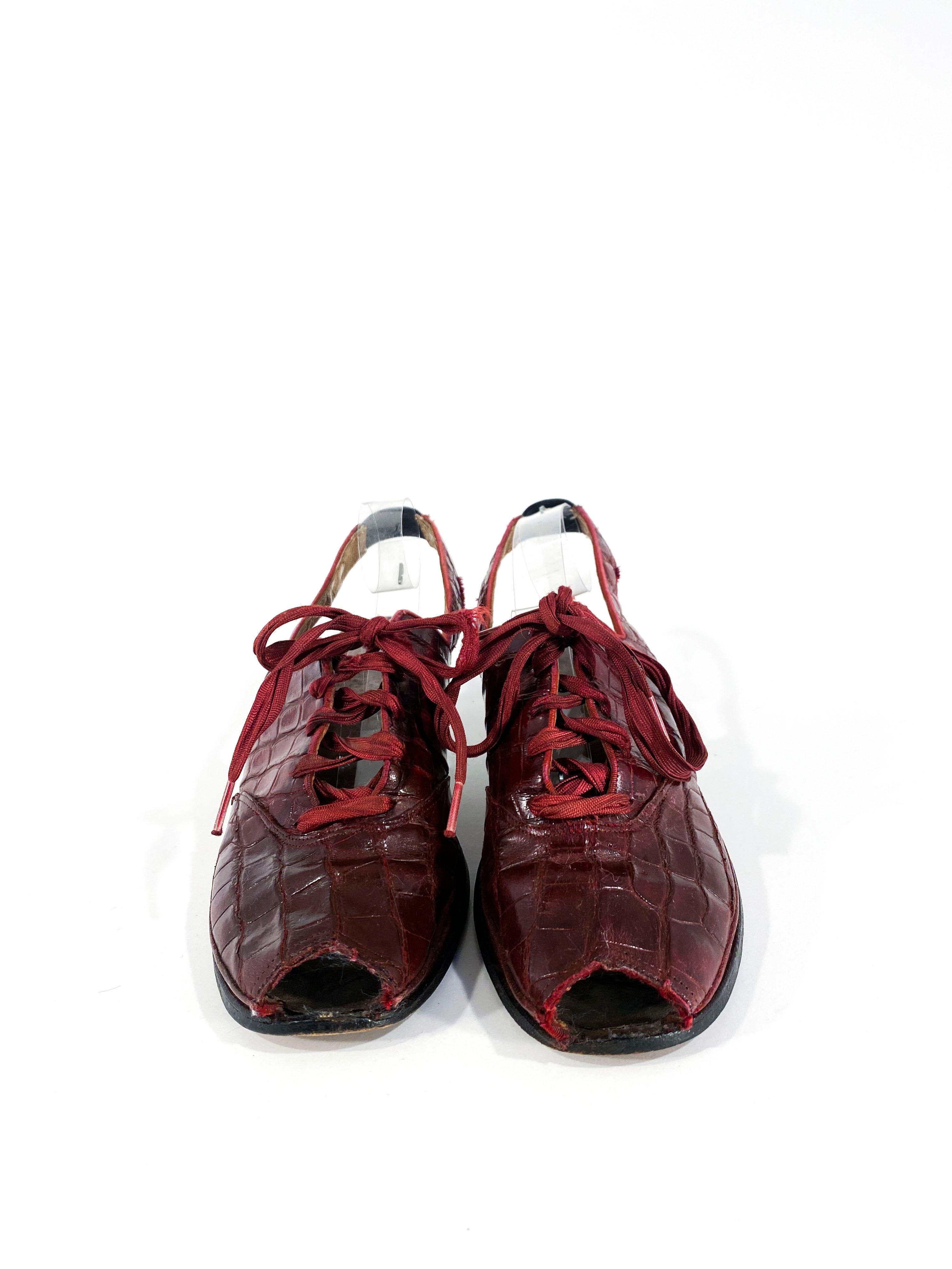 1930s Burgundy red alligator peep toe sling-back lace up heels with a modest 1.5 inch high heel in a contrasting black. These shoes have a leather sole and are completely handmade. 