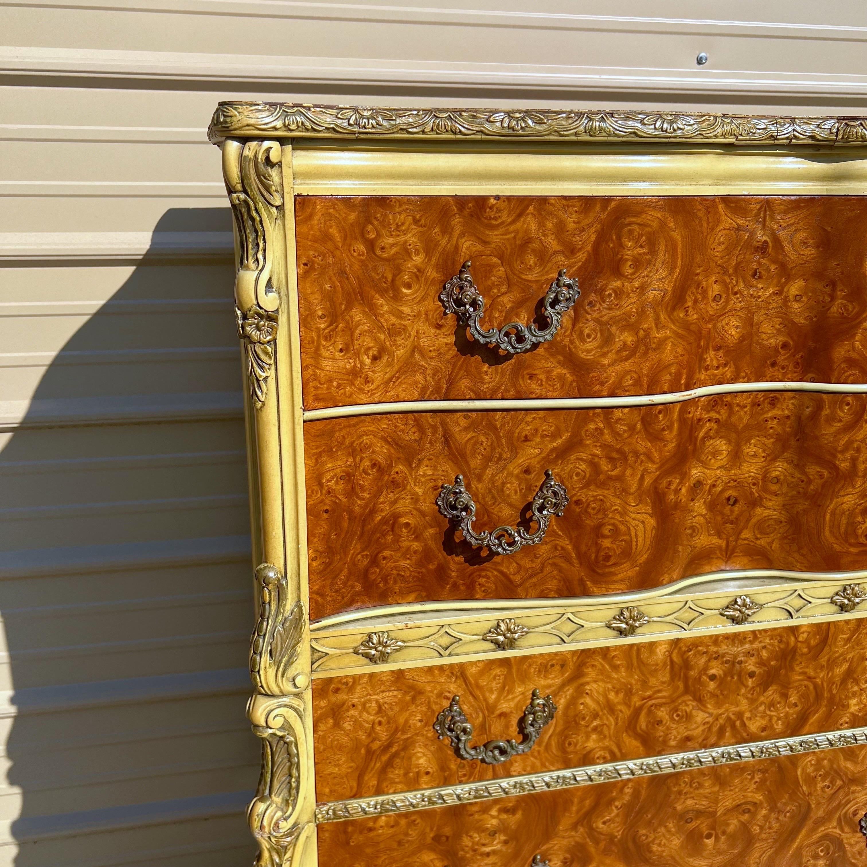 Stunning rare African avoider Burled wood with ornate carved details, hand painted, and original brass hardware.  A very sexy serpentine front on the top drawers.  Manufactured in the USA by Romweber circa 1940’s.   Please see our other listings for