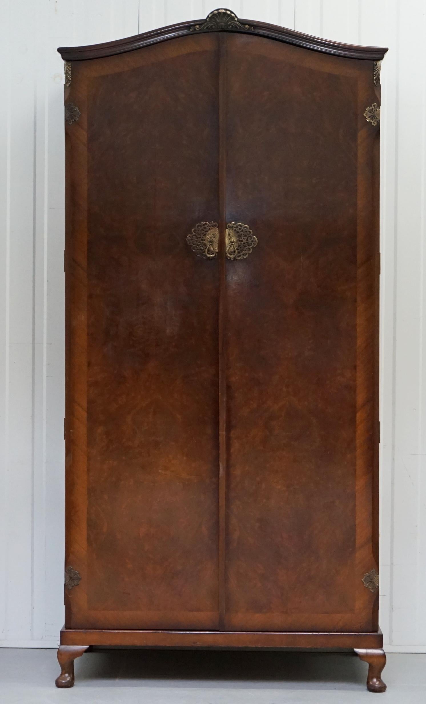 We are delighted to offer for sale this lovely Burr walnut medium double bank wardrobe with built-in pigeon hole storage, part of a suite.

This wardrobe is a normal size and offers lots of storage space, the side pigeon hole storage is great for