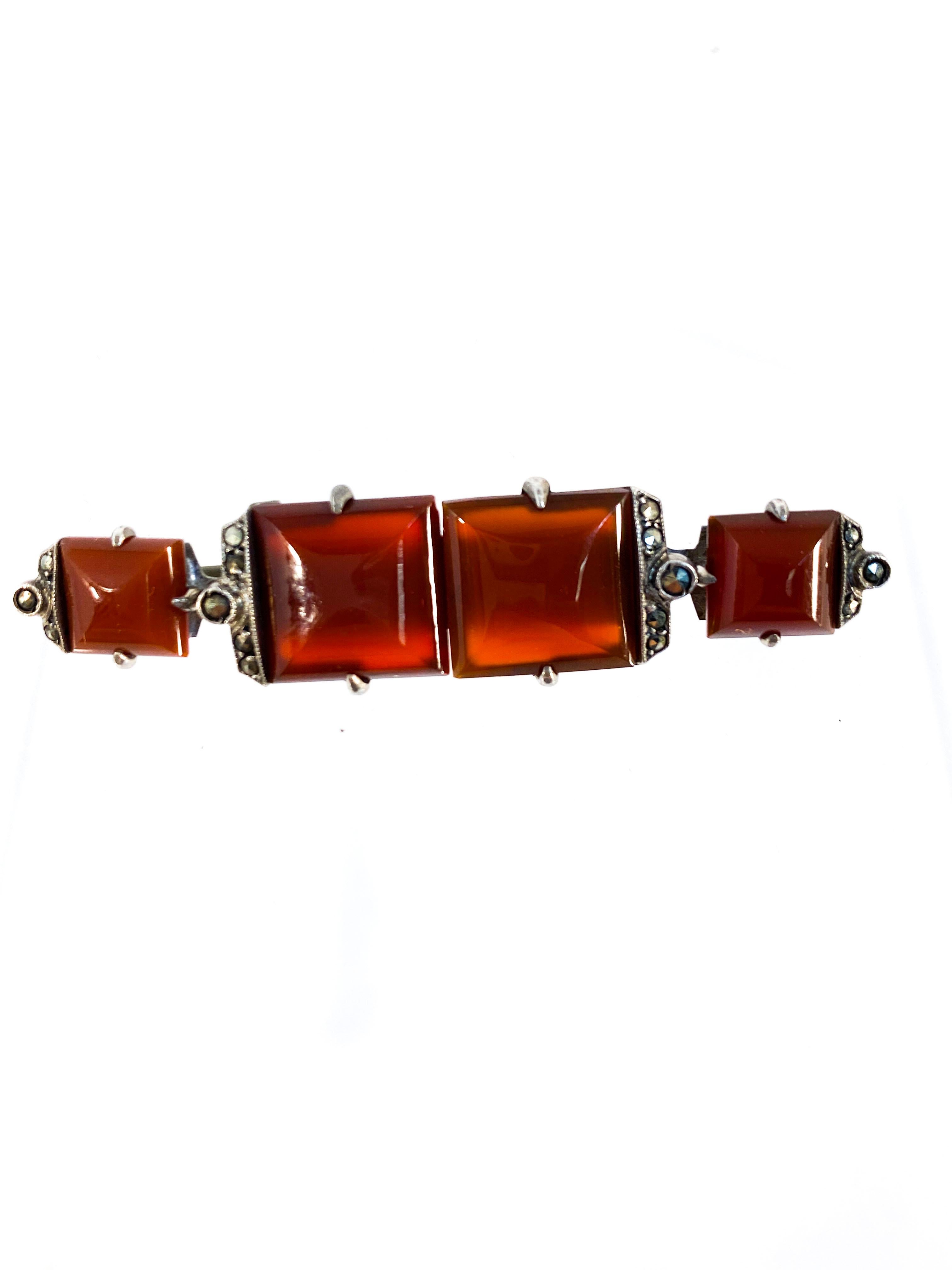 1930s Depression era carnelian pin with marcasite accents all set in sterling silver. The back has a standard long pin and clasp.