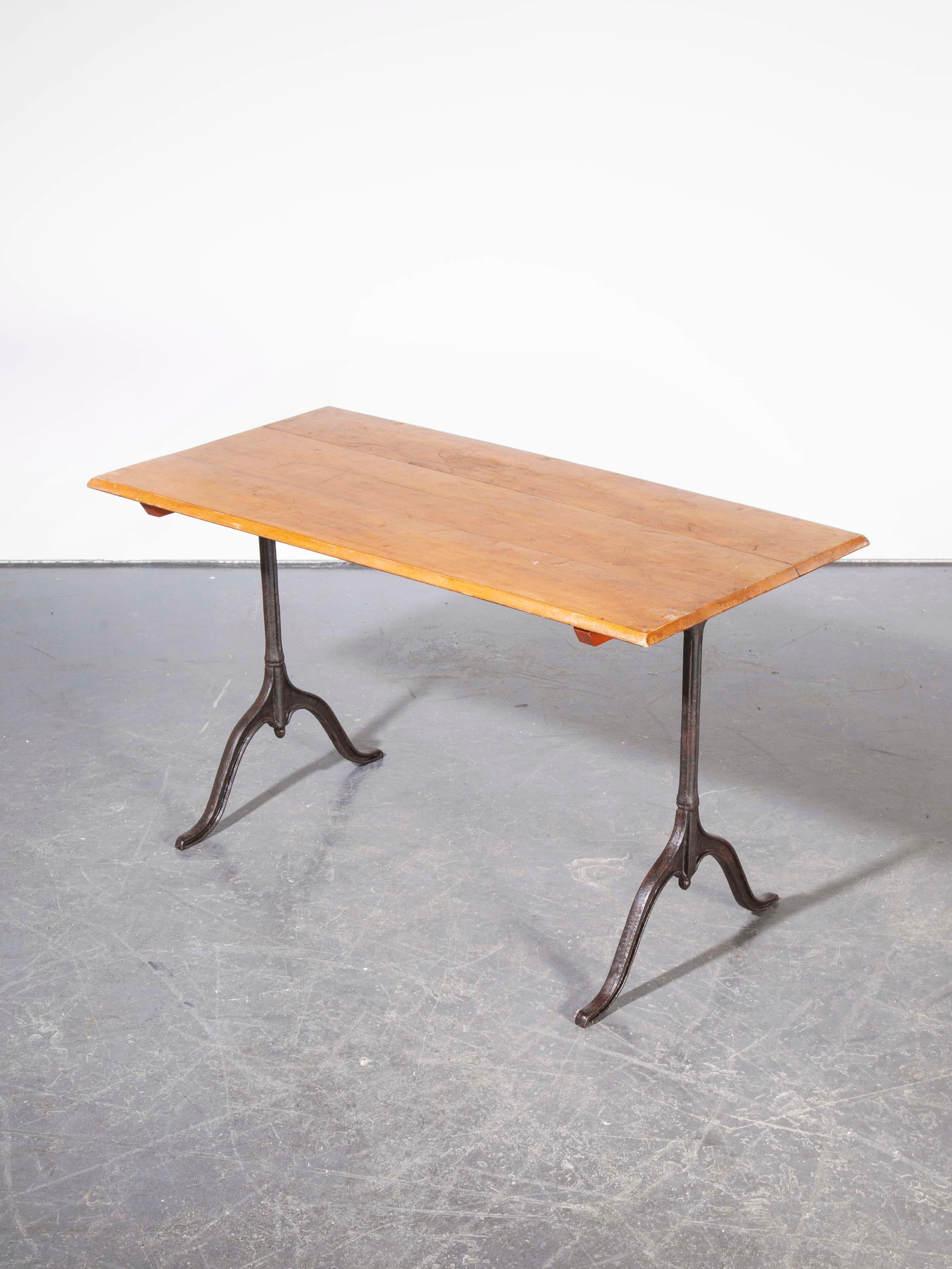 1930s cast metal base Kronenbourg café dining, bistro table, model one. Four tables are available, this is a listing for one table as photographed. Sourced from the original Kronenbourg site in Alsace, these were found languishing in a disused part