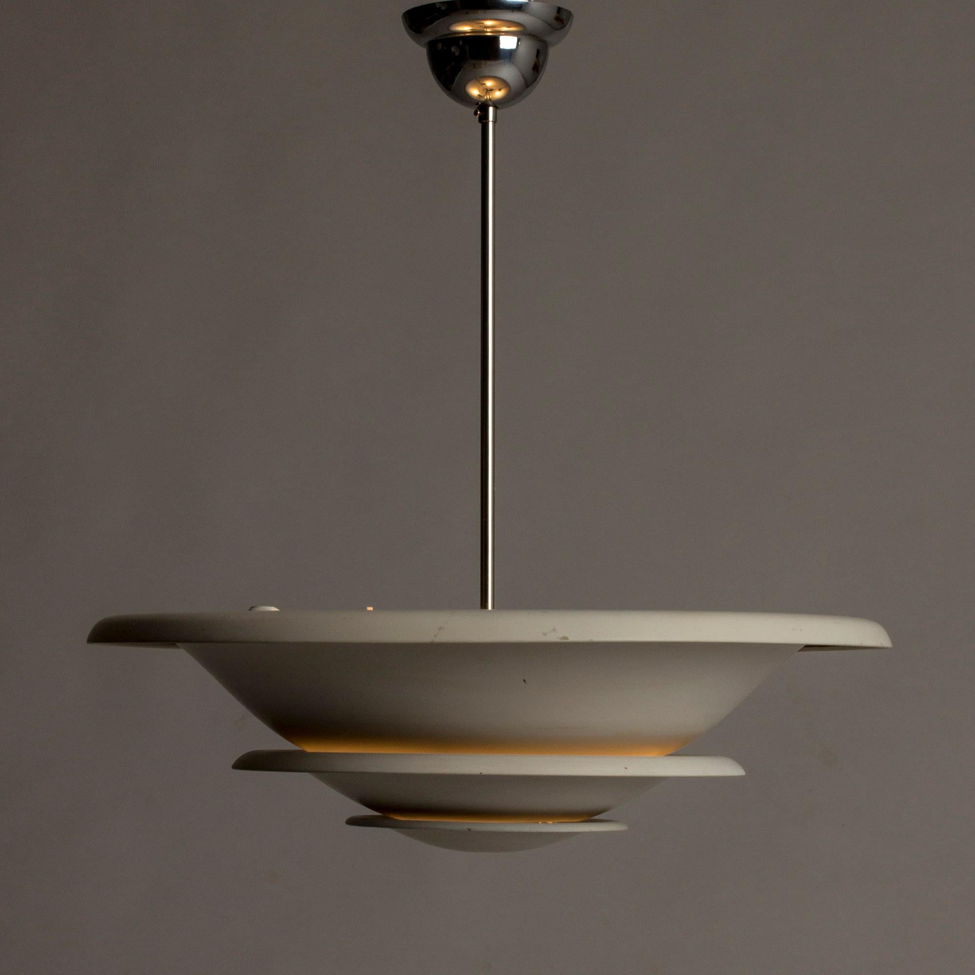 Elegant ceiling lamp from Bröderna Malmström, made in the 1930s. Made in sections that let light out softly between them and towards the ceiling.