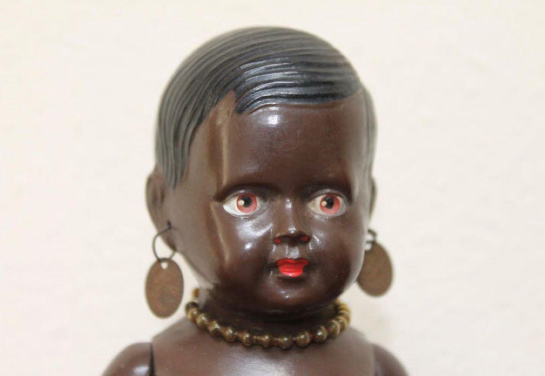 1930s Celluloid Doll.
A cute little black sitting doll, Afro-American Celluloid doll by Cellba dolls Germany.
An antique cellulloid - tortoise toy doll with movable arms and legs
Marked: DRP Germany 18 1/2. 
This adorable little doll has beautiful