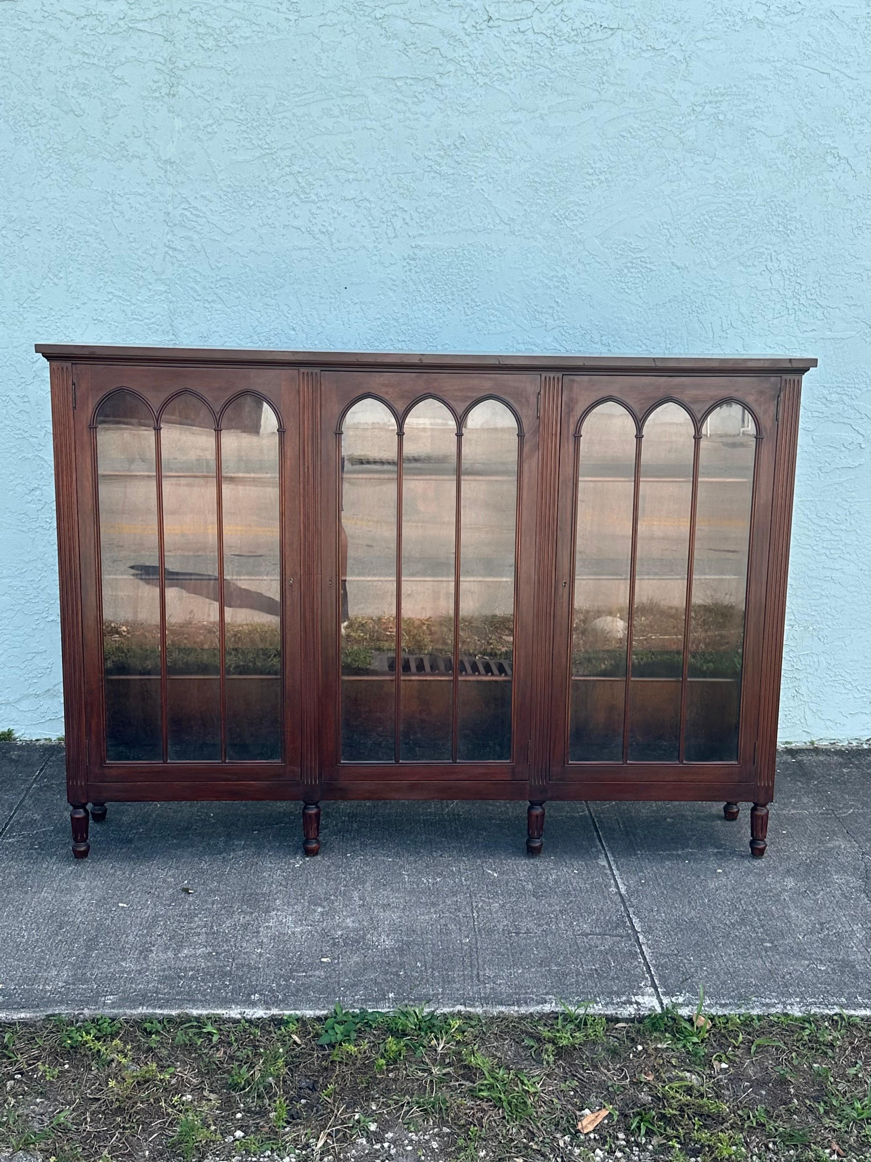On offer on this occasion is one of the most stunning and rare, arched glass bookcase cabinet you could hope to find. Outstanding design is exhibited throughout. The beautiful bookcase is statement piece and packed with personality!! Just look at