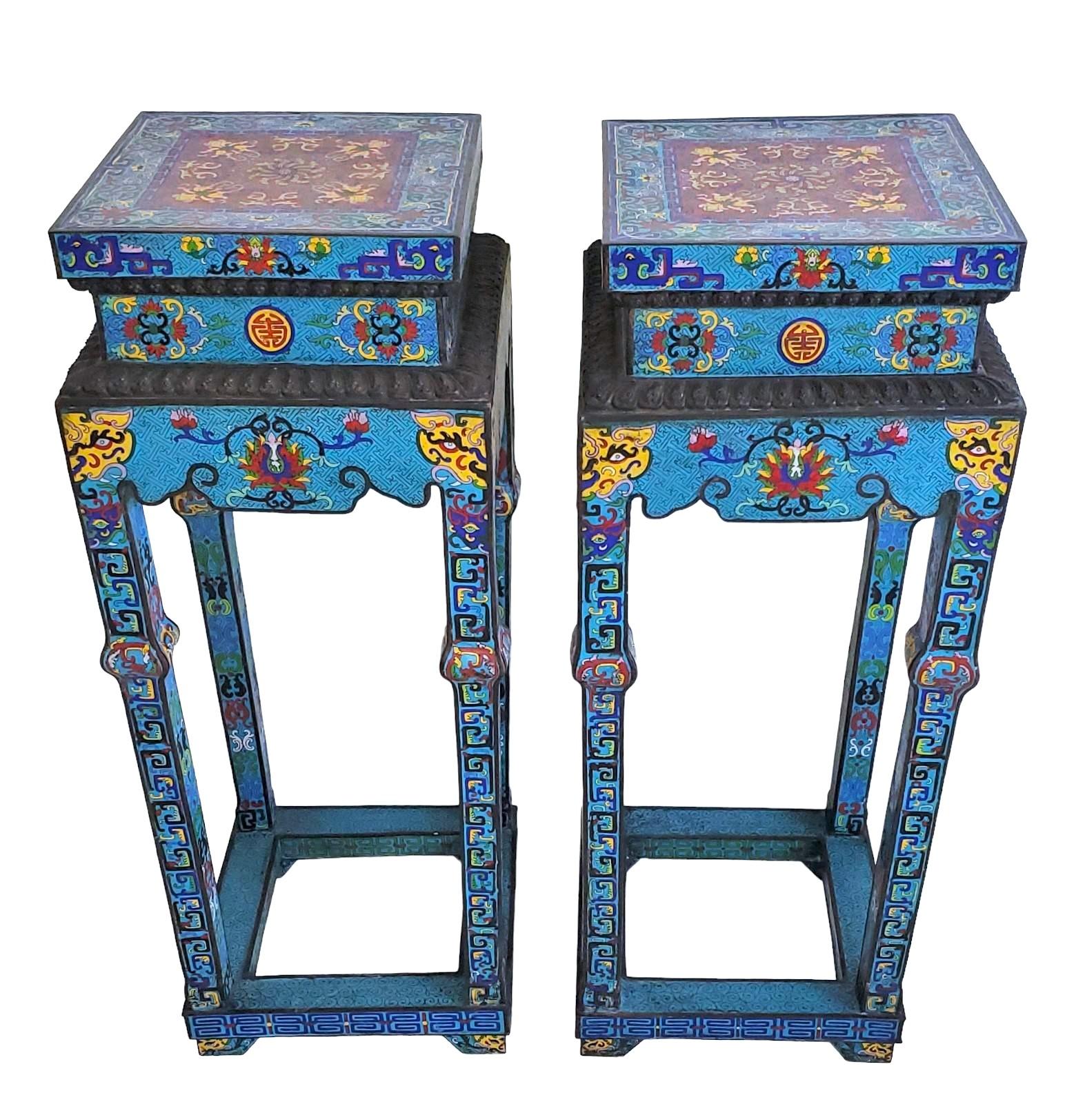 Pair of 1930s Chines Mink Design Cloisonne Pedestal. Wonderful bright colors to the pedestals with a wonderful floral/geometric design.

Minor scratches to surface. Measurements are approximate - 38h x 15d x 15w.