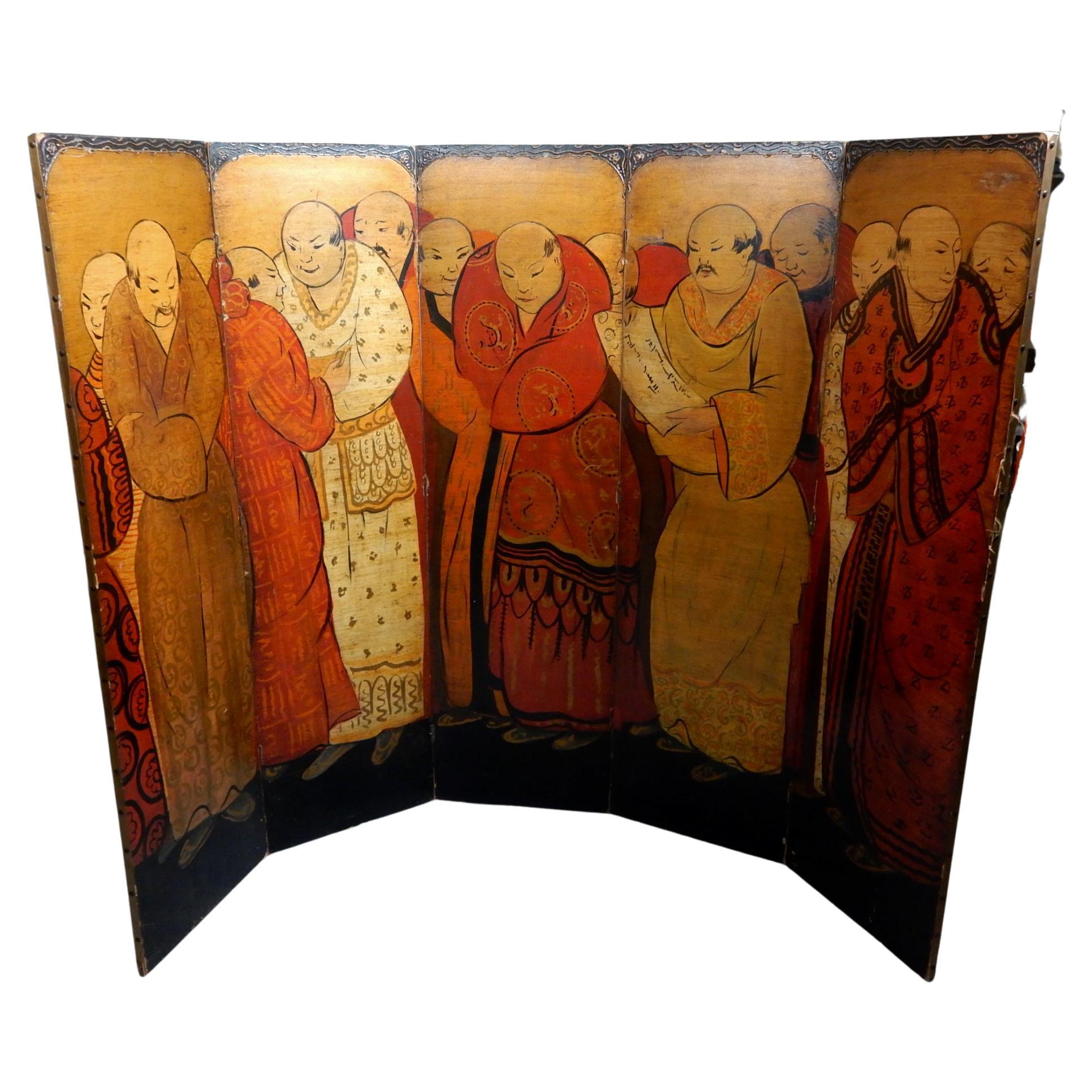 Circa 1930's five panel room divider screen.
Hand painted scene of a gathering of Chinese scholars
Dressed in brightly colored robes.
Nailhead edges with decorative top of panels.
The antiquity and charm of this piece is delightful.
Back is