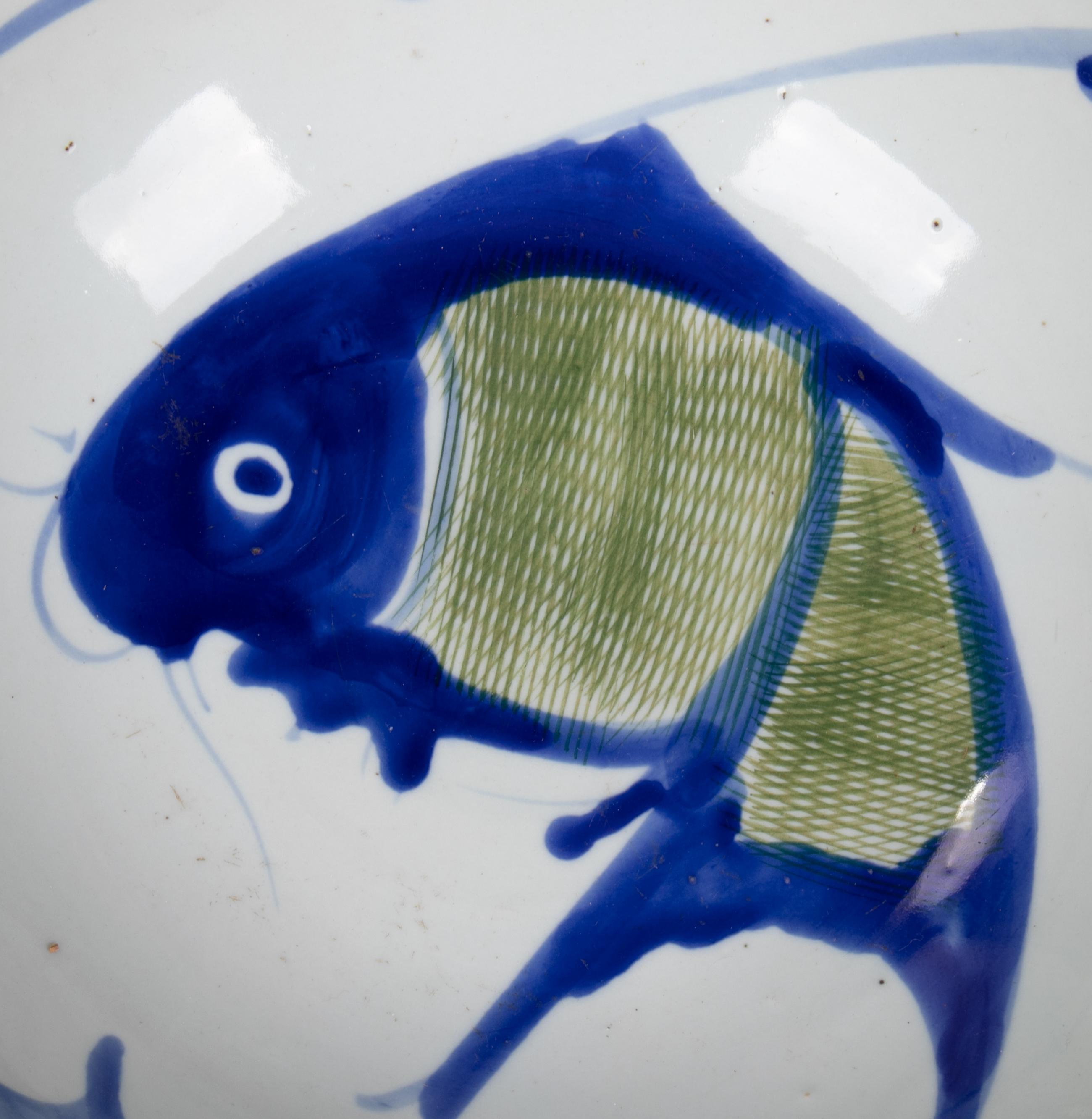 1930s Chinese pair of porcelain blue and white fish painted plates.