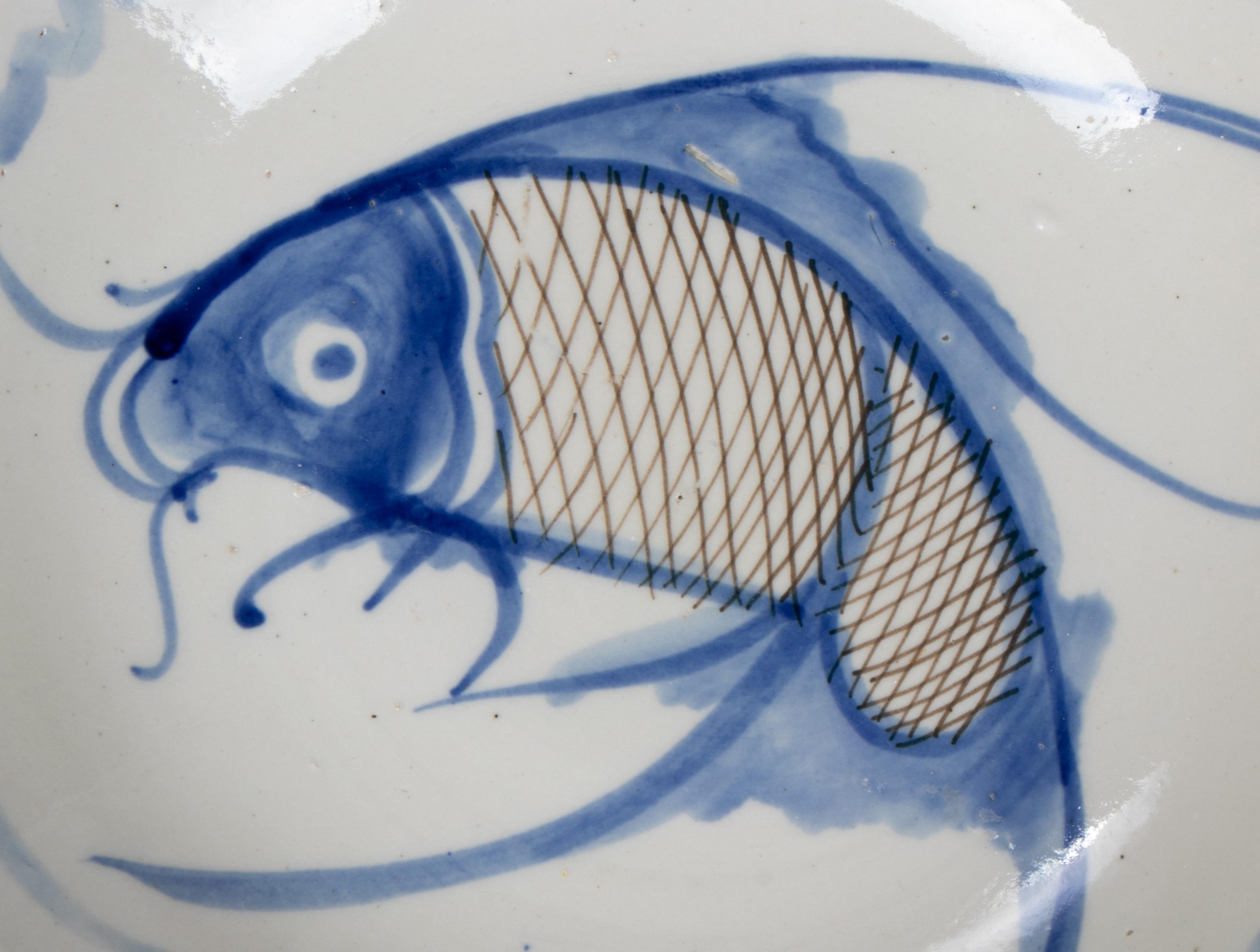 blue and white fish plates