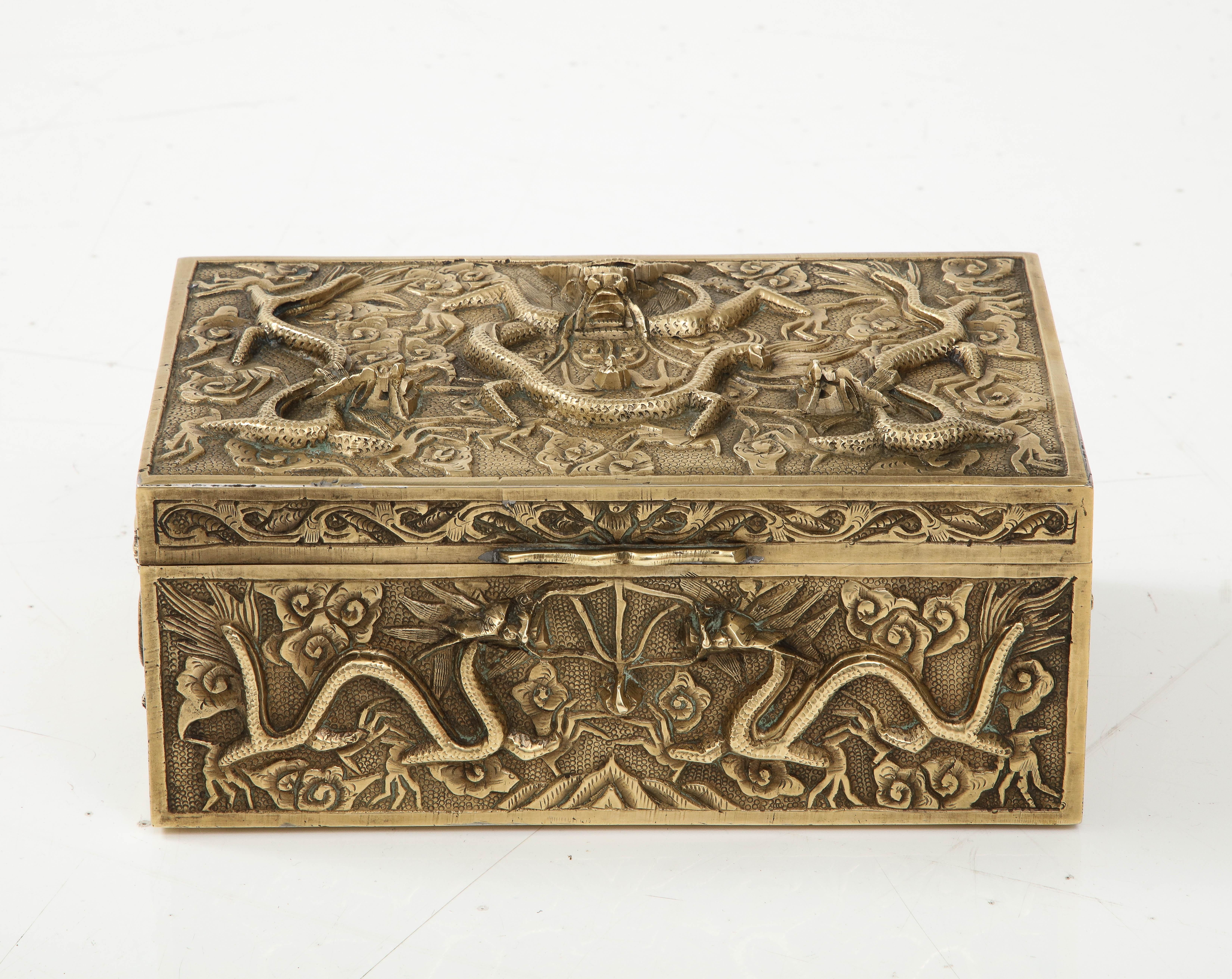 Beautiful 1930's solid brass Chinese jewelry box with dragon inlay motif and wood interior, in vintage condition with some wear to the good and patina to the brass, lightly hand polished.
