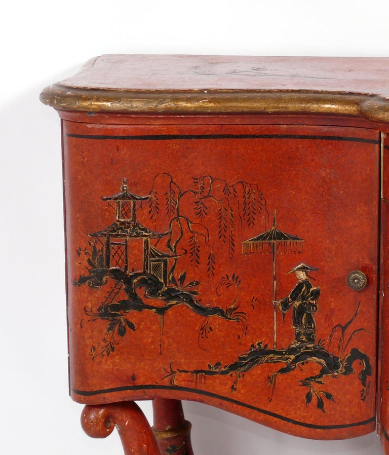 Hand Painted Chinoiserie Cabinet or Credenza, probably Chinese Export, circa 1930s or earlier. This piece is a versatile size and can be used as a credenza, cabinet, sideboard, or bar in a living area, or as a chest or dresser in a bedroom. 