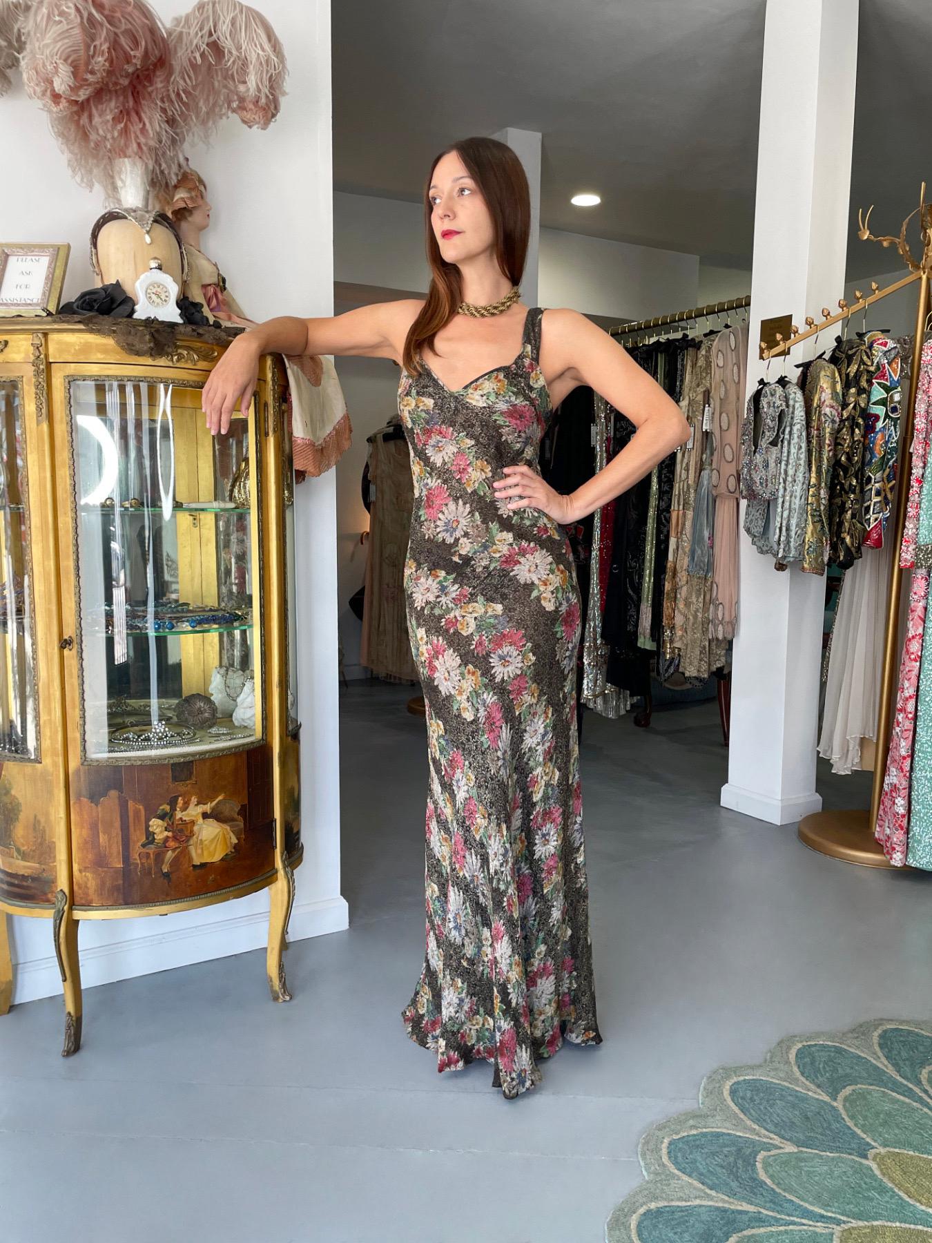 An absolutely stunning and incredibly rare metallic floral motif lamé bias-cut gown dating back to the 1930's 'Old Hollywood' era of glamour. So Jean Harlow! The fabric itself is a masterpiece! I've never seen such a colorful floral lamé print