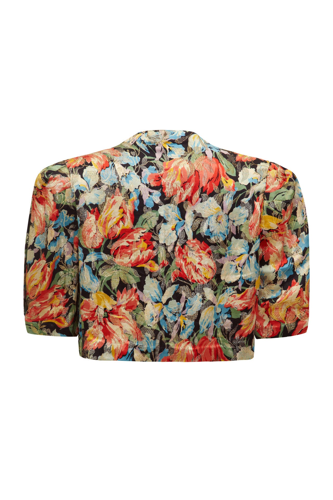 Stunning 1930s bright floral print jacket / bolero with a beautiful gold lame floral design layered on top. As this piece is worn open with no fastenings there is slight flexibility in size and there is slight padding to the shoulders to give some