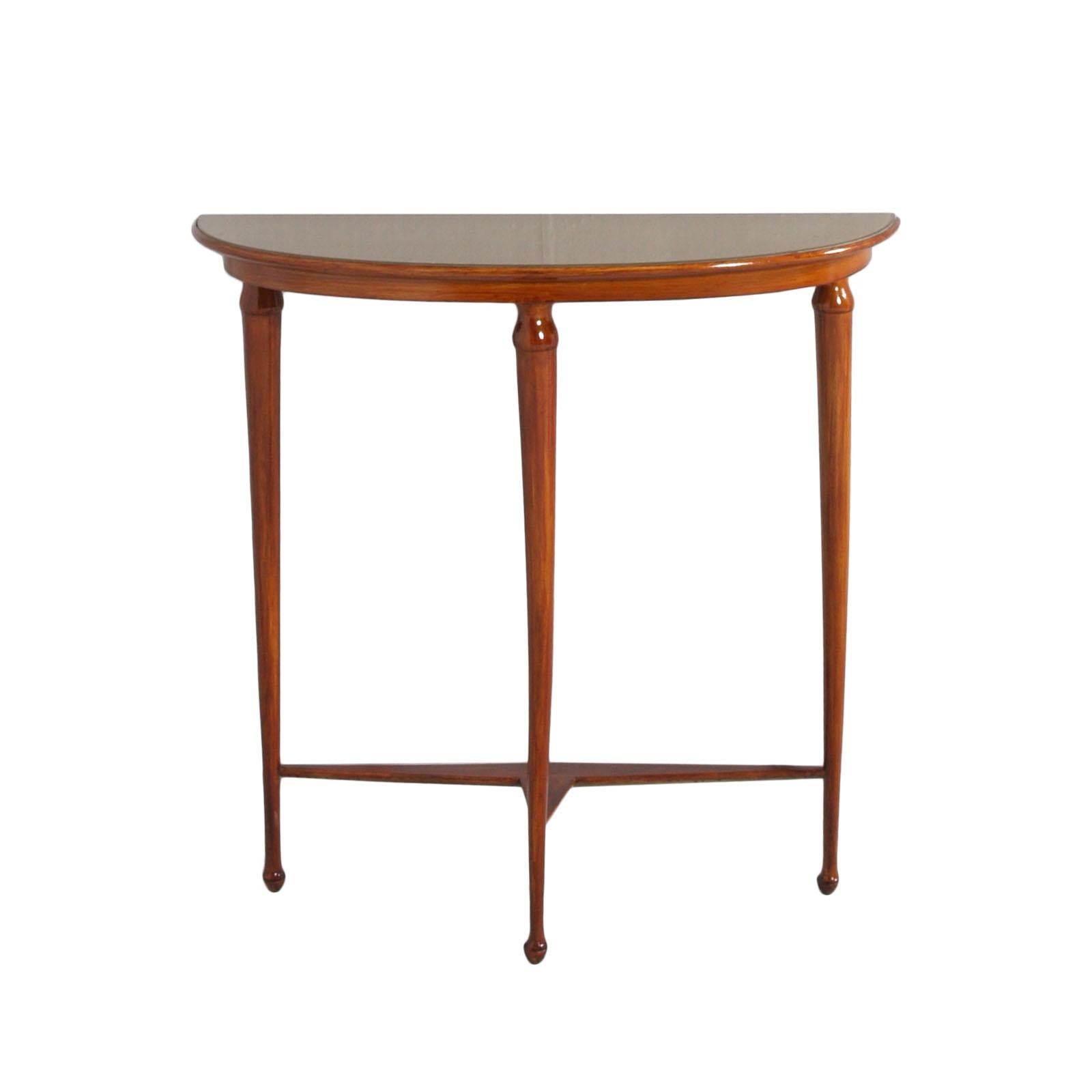 Console with mirror strongly attributable to Gio Ponti for the characteristic shapes of the console's legs and mirror; in walnut polished to wax. The top of the console is in lacquered glass in the lower part, with a pleasant shade matched to the
