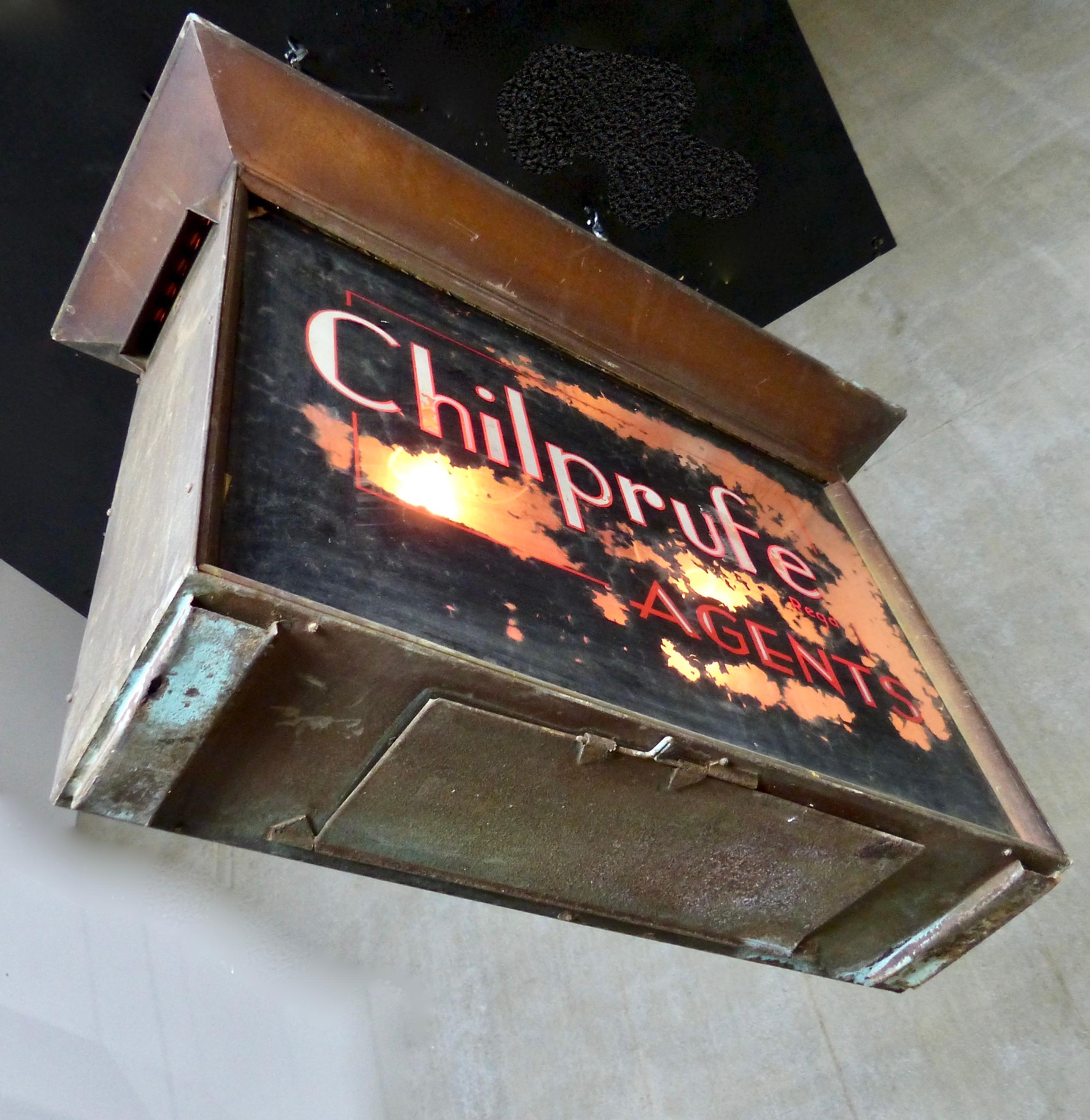 An electric, double-sided outdoor sign promoting the English clothing manufacturer, Chilprufe Agents (operating between 1920 and 1950). The company’s logo has been reverse painted on glass. The sign has been re-wired and CSA approved to current