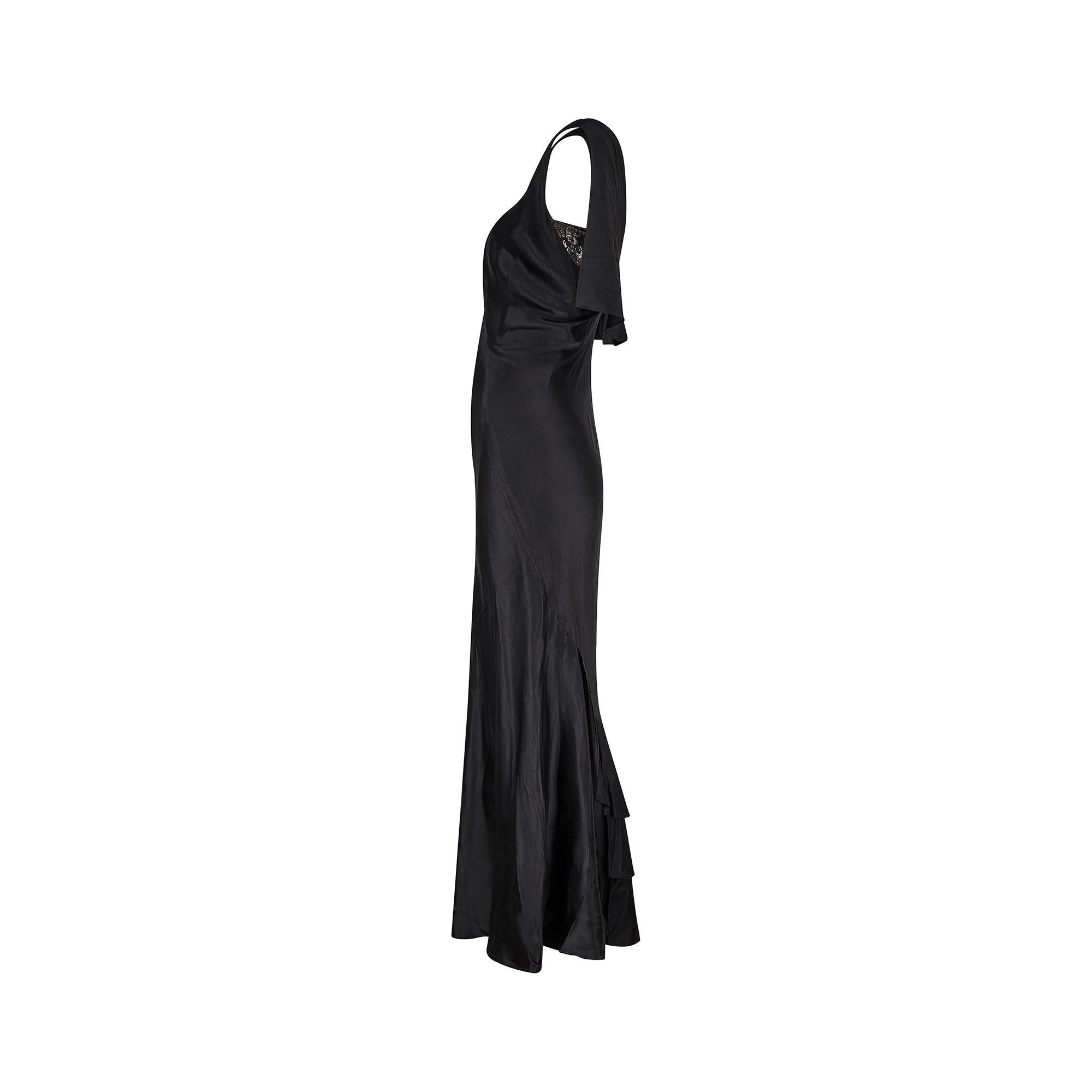 This 1930s French couture evening dress is a luxurious wardrobe addition for any fans of this era, or anyone after an eye-catching gown for an upcoming event. It is crafted from high shine, inky black silk and accented with a gold and black lamé