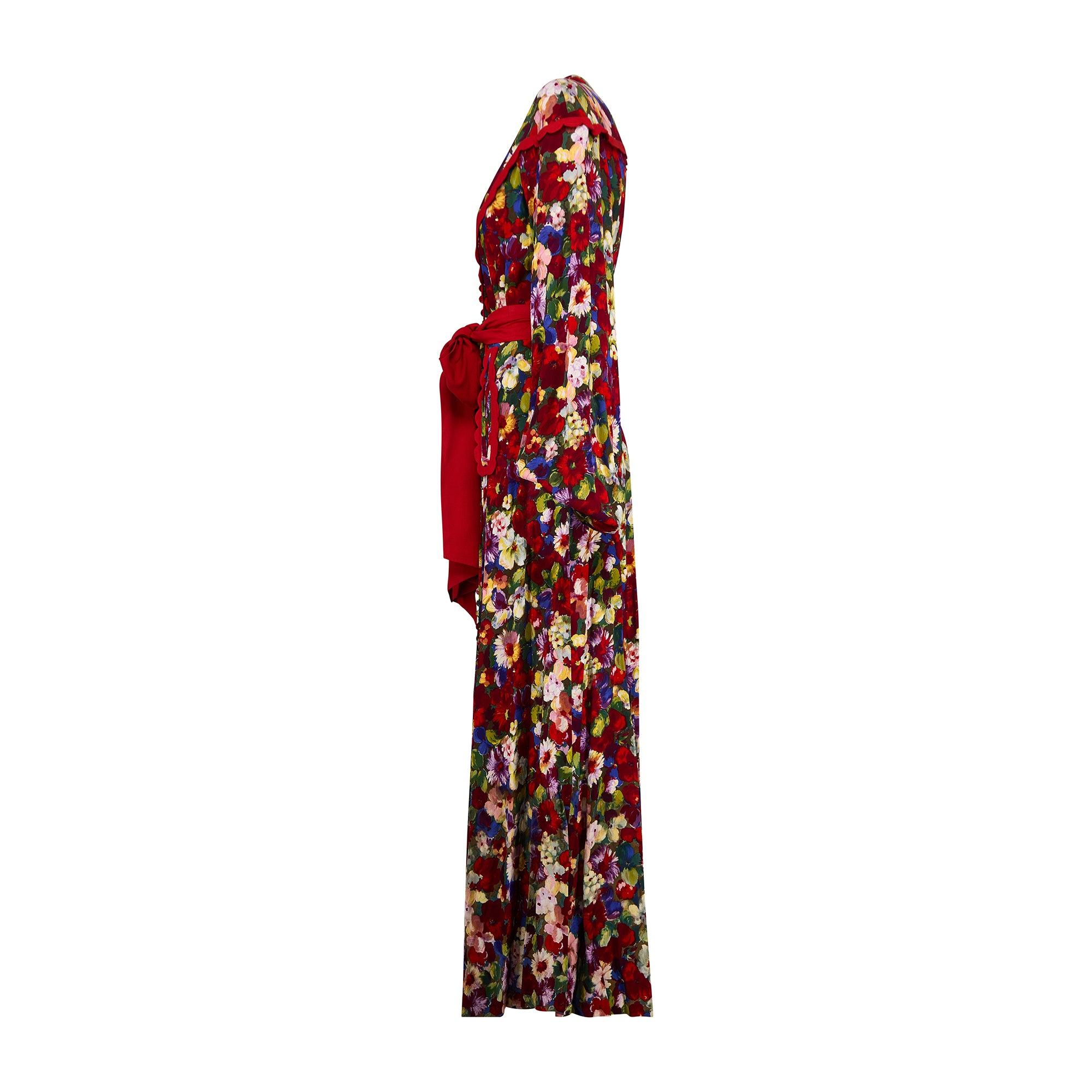 This outstanding 1930s vibrantly printed maxi dress is one of the best we have ever had in Circa's collection. From France and made to couture standards, the fabric is wonderful; tailored from a high quality crepe patterned with clusters of