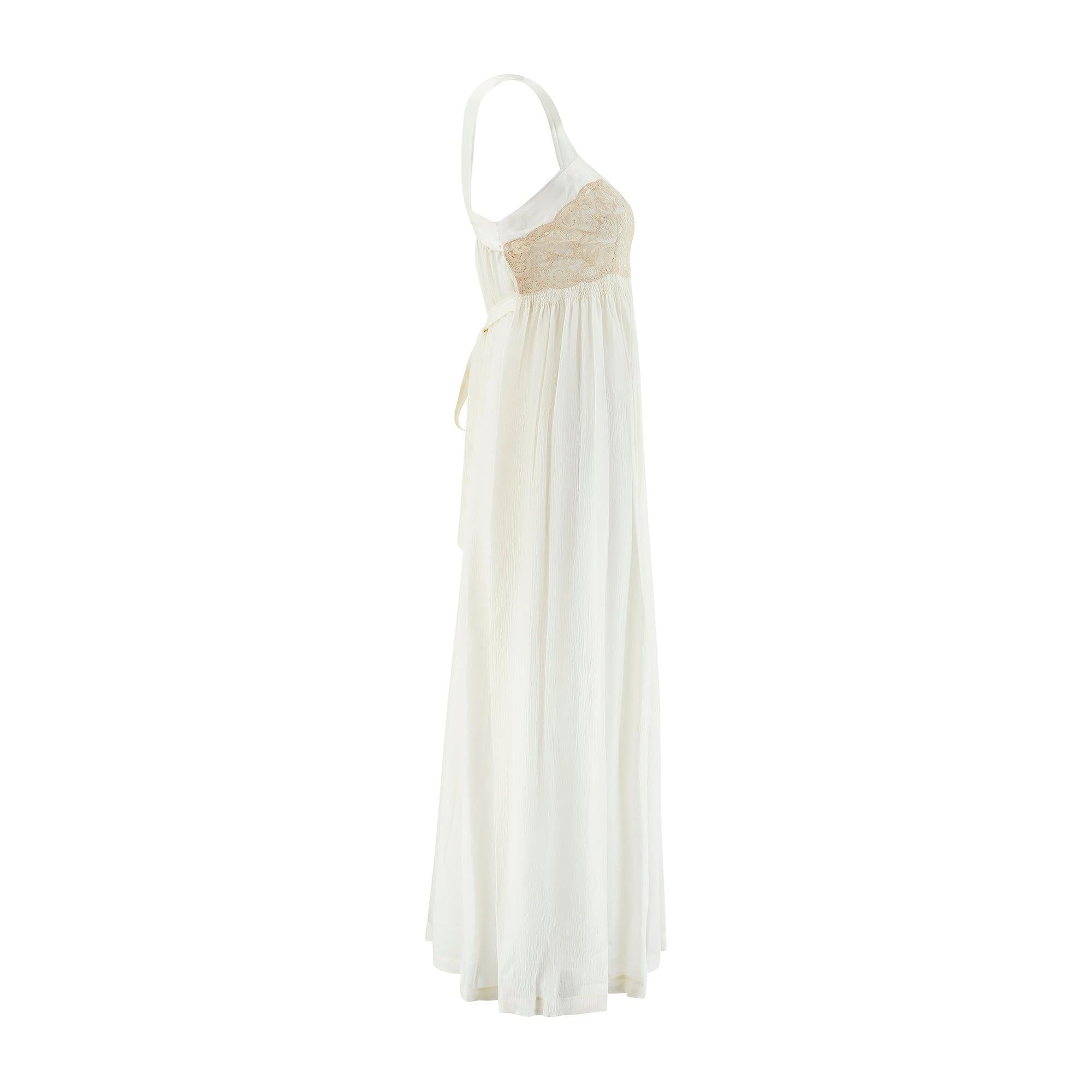 This pretty slip dress was made in the 1930s and displays many signature details of the era’s best lingerie designs. It is tailored from the palest cream silk with coordinating, wide silk-satin straps. It has an empire line cut formed from gathering