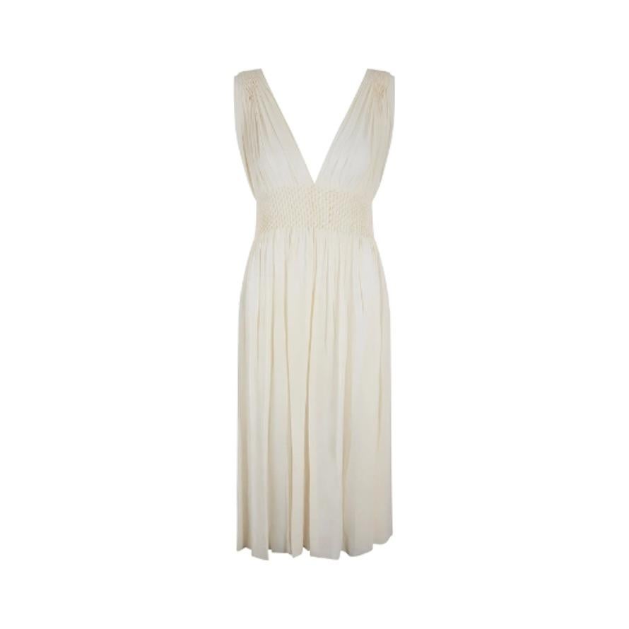 This is a very floaty and ethereal, original 1930s cream silk crepe dress.  It has the most outstanding, entirely hand stitched smocked detail that encompasses the wide waistband and the shoulder.  It’s a diamond smocked pattern and the dress, quite