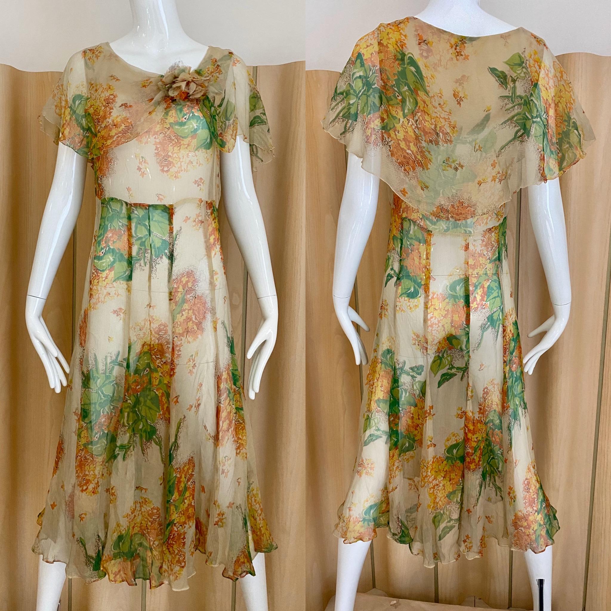 Vintage 30s creme, green, orange floral print silk day dress.
Fit size 2/4