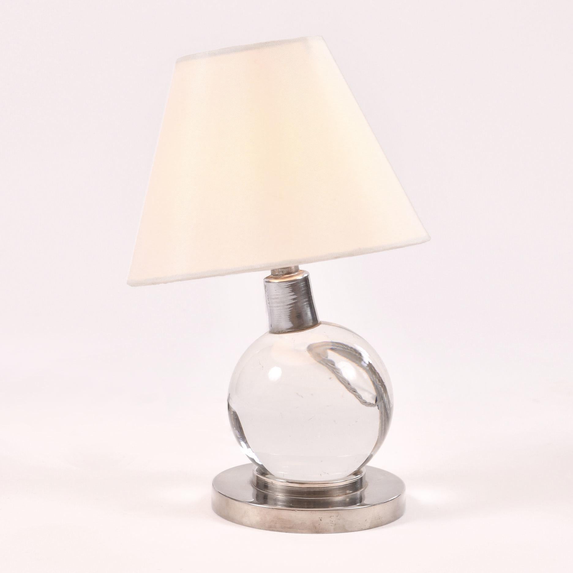 Classic design: Tilting crystal ball lamp on a circular chrome base.

Provenance: Private Collection, Buenos Aires – recently brought over to the UK.

Jacques Adnet (1900–1984) understood the beauty of combining practicality with geometric