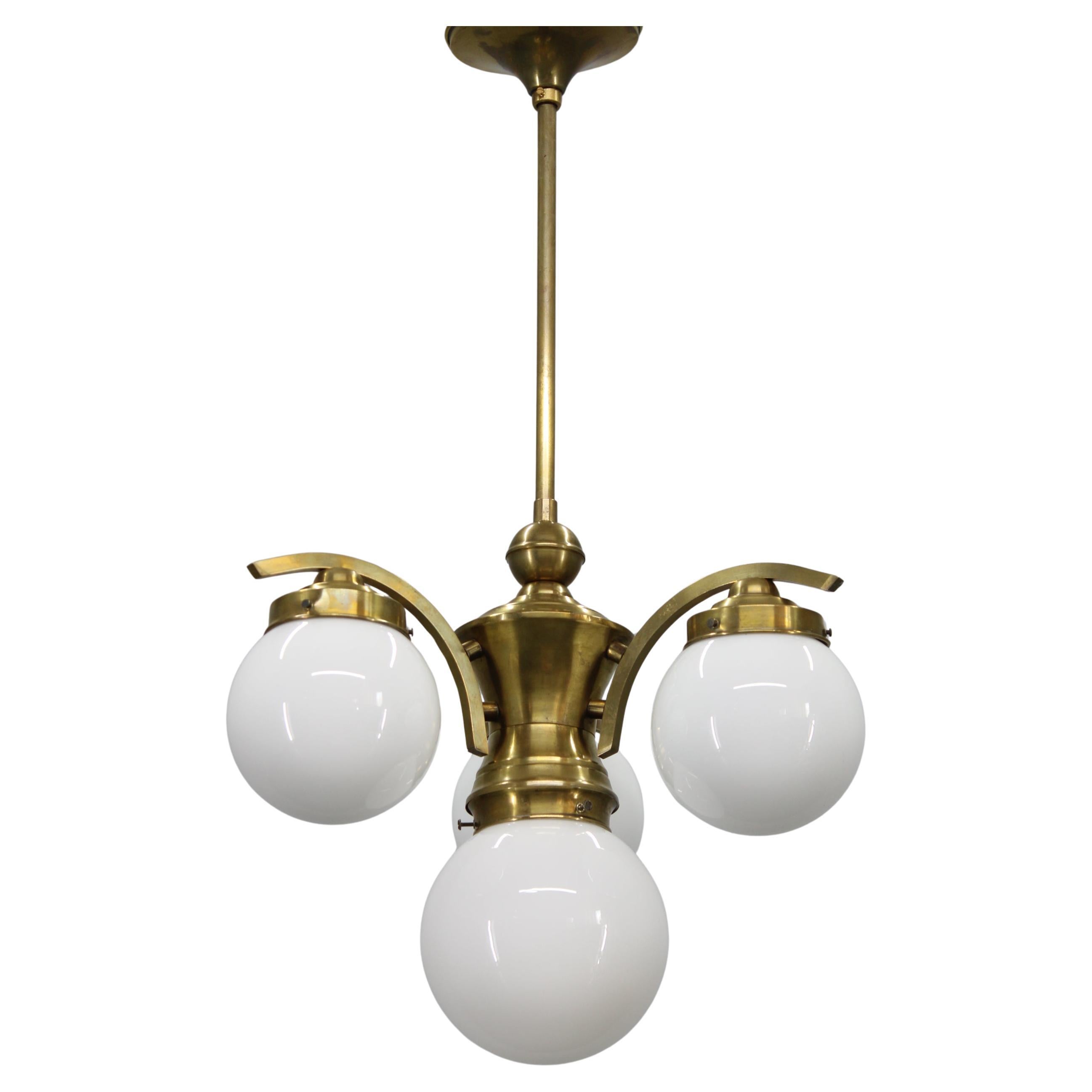 1930s Czechoslovak Art Deco Brass Chandelier with Four Opaline Glass Globes