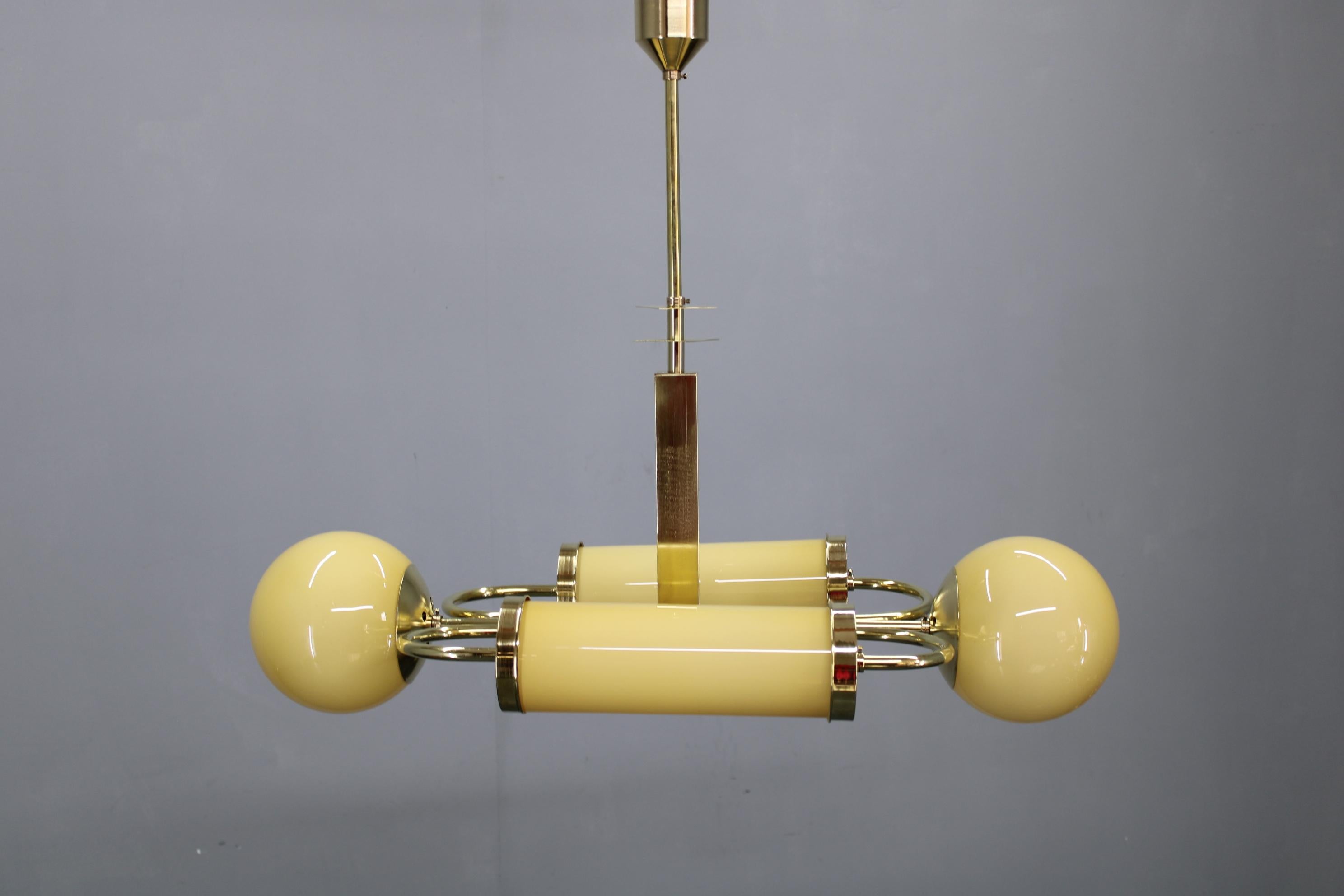 Lucidato 1930s Czechoslovak Art Deco Brass Chandelier with Globe and Opaline Shades in vendita