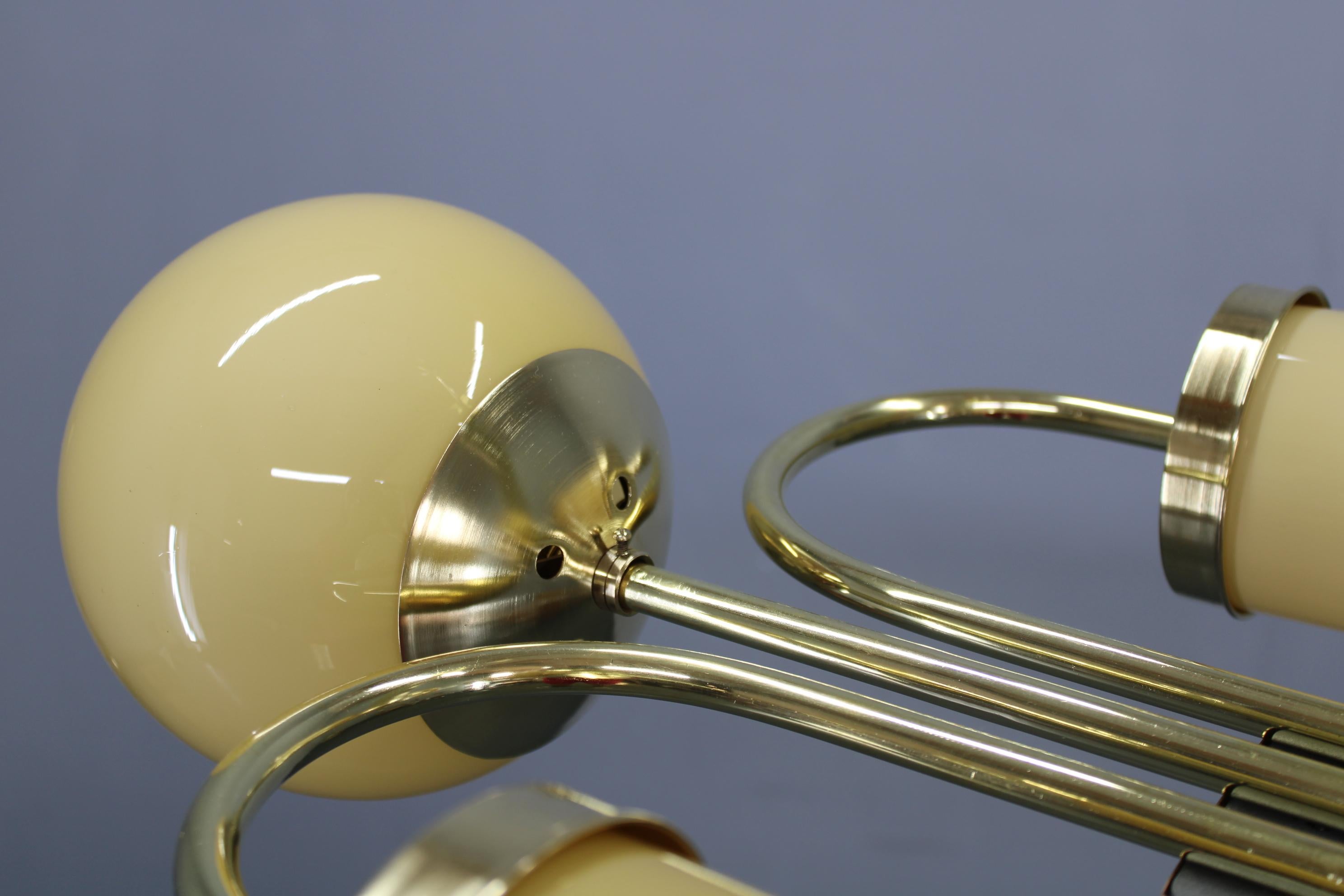 Metà XX secolo 1930s Czechoslovak Art Deco Brass Chandelier with Globe and Opaline Shades in vendita