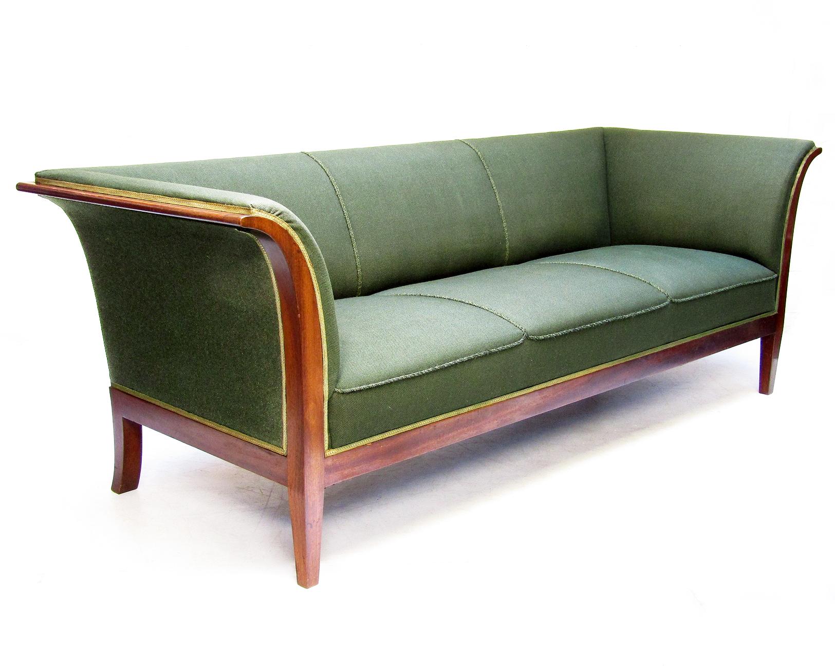A striking Danish 3-seater sofa in Cuban mahogany by Frits Henningsen.

In competition with his teacher Kaare Klint, Henningsen was one of the outstanding designers of the early 20th century. A central aim was to modernise and refine earlier 19th