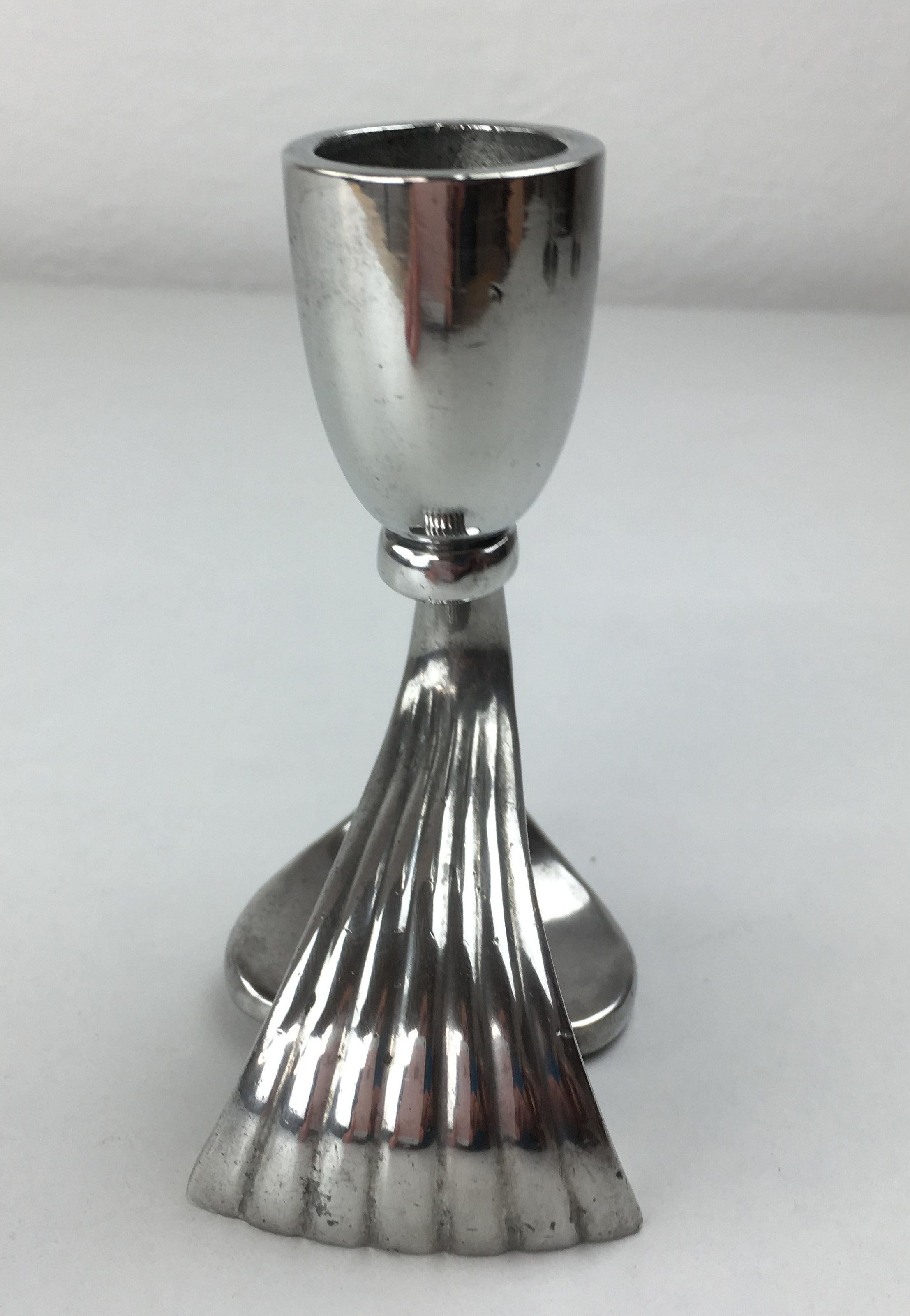 Danish Just Andersen Art Deco pewter candle holder produced by Just Andersen A/S in the 1930's.

The candle holder is in good vintage condition and marked with Just. Andersens triangle mark. 

Just Andersen 1884-1943 was born in Godhavn on the