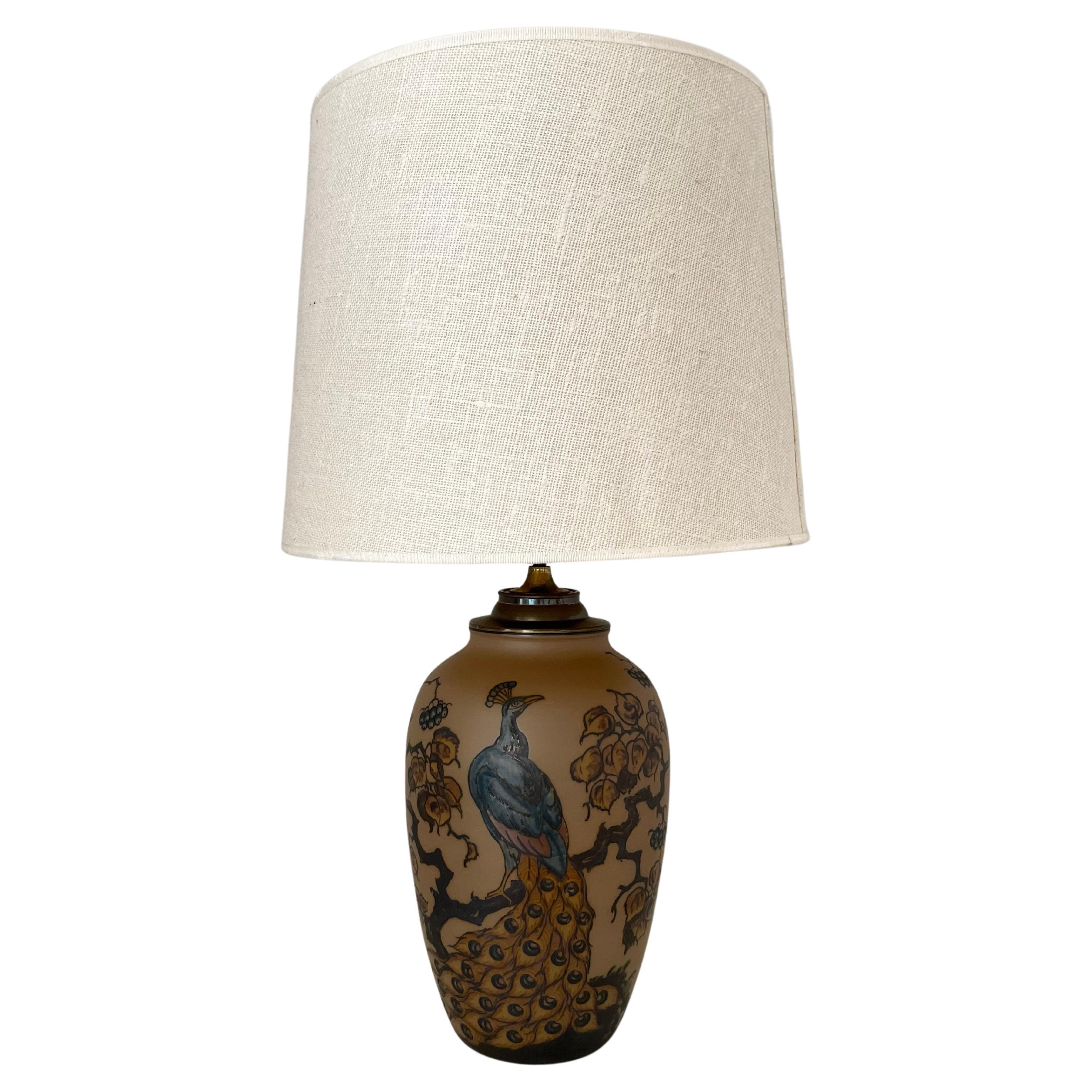 1930s Danish art nouveau ceramic table lamp decorated with peacock by L. Hjort
